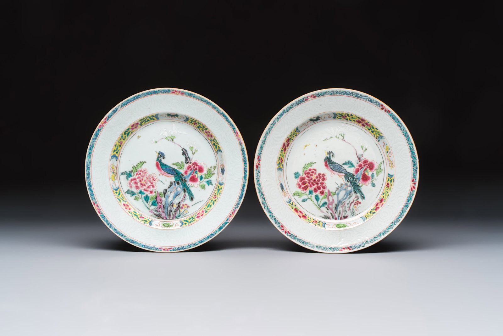 A pair of Chinese famille rose 'Peacock and Flowers' plates, Yongzheng: A pair of Chinese famille rose 'Peacock and Flowers' plates, Yongzheng Dia.: 22,3 cm