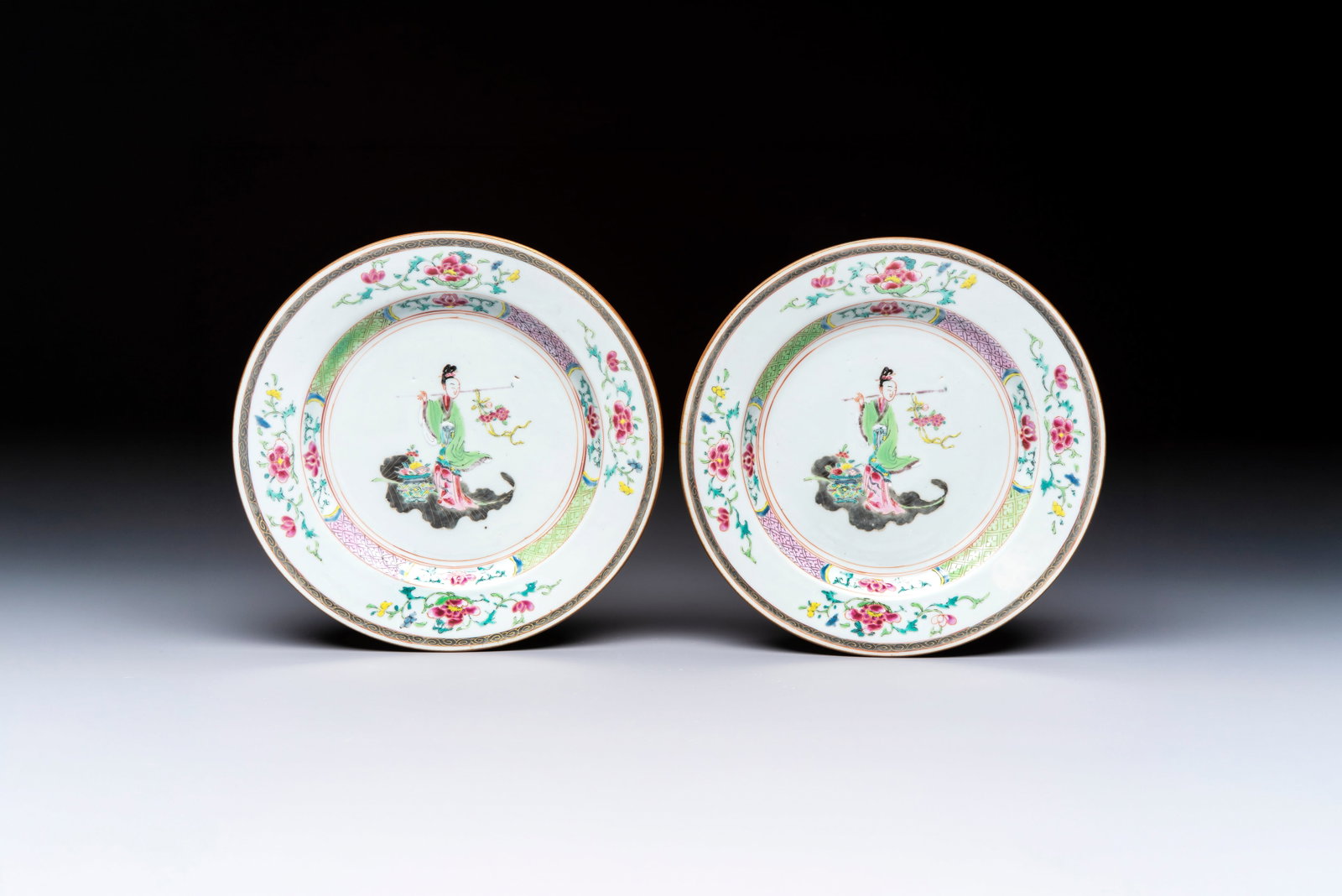 A pair of Chinese famille rose 'Magu' plates, Yongzheng/Qianlong (1 of 2)