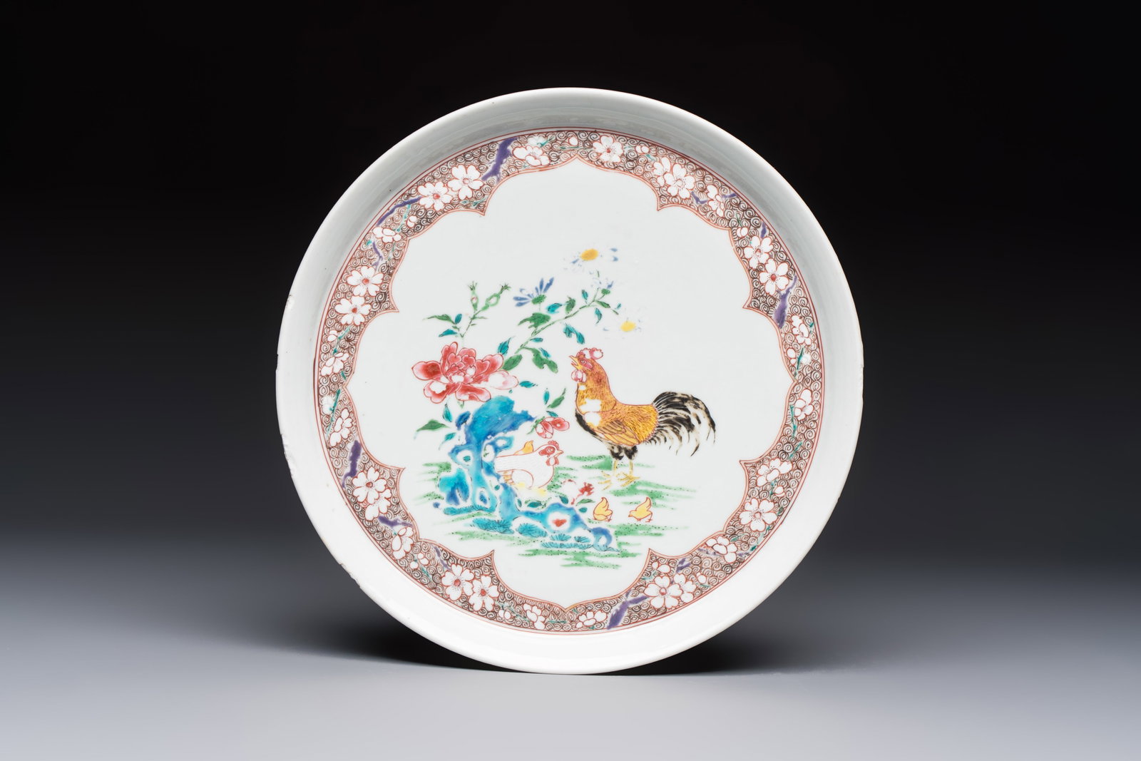 A Chinese famille rose 'Rooster' plate, Yongzheng mark and of the period (1 of 2)