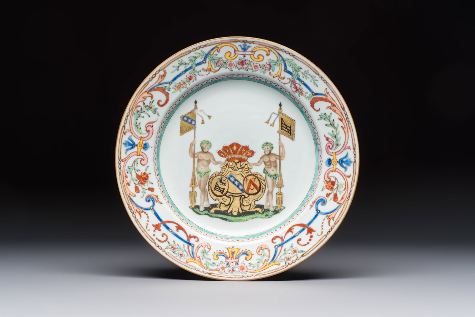 A Chinese famille rose armorial dish with the arms of Goos de Ghyseghem, Vecquemans and Golbeau for (1 of 2)