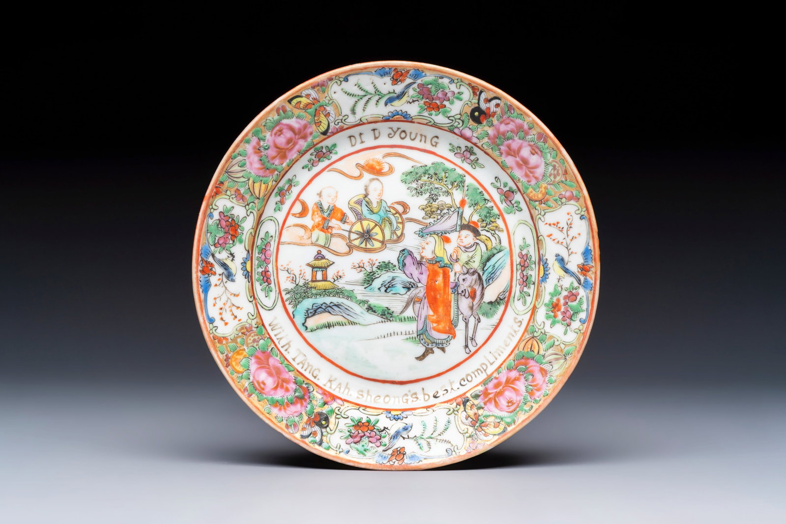 A rare Chinese Canton famille rose saucer inscribed 'Dr. D. Young', 19th C. (1 of 2)