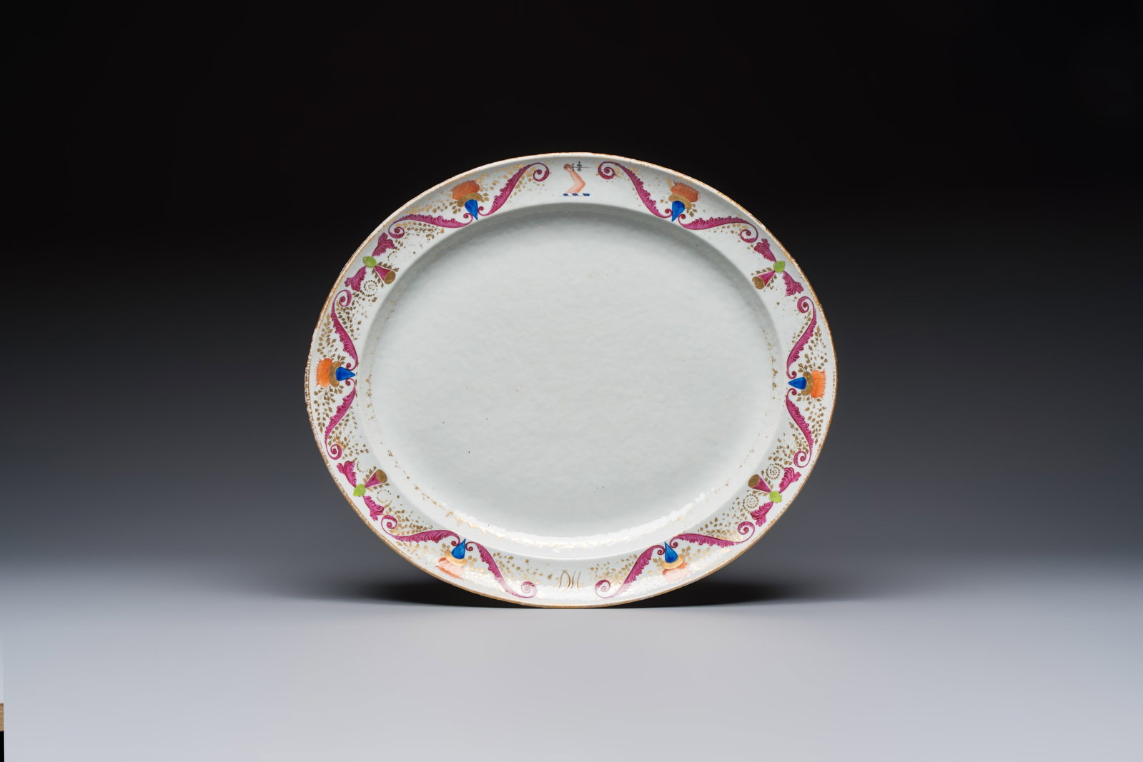 A Chinese polychrome and gilt-decorated armorial dish with the arms of McMahon, Jiaqing, ca. 1810 (1 of 2)