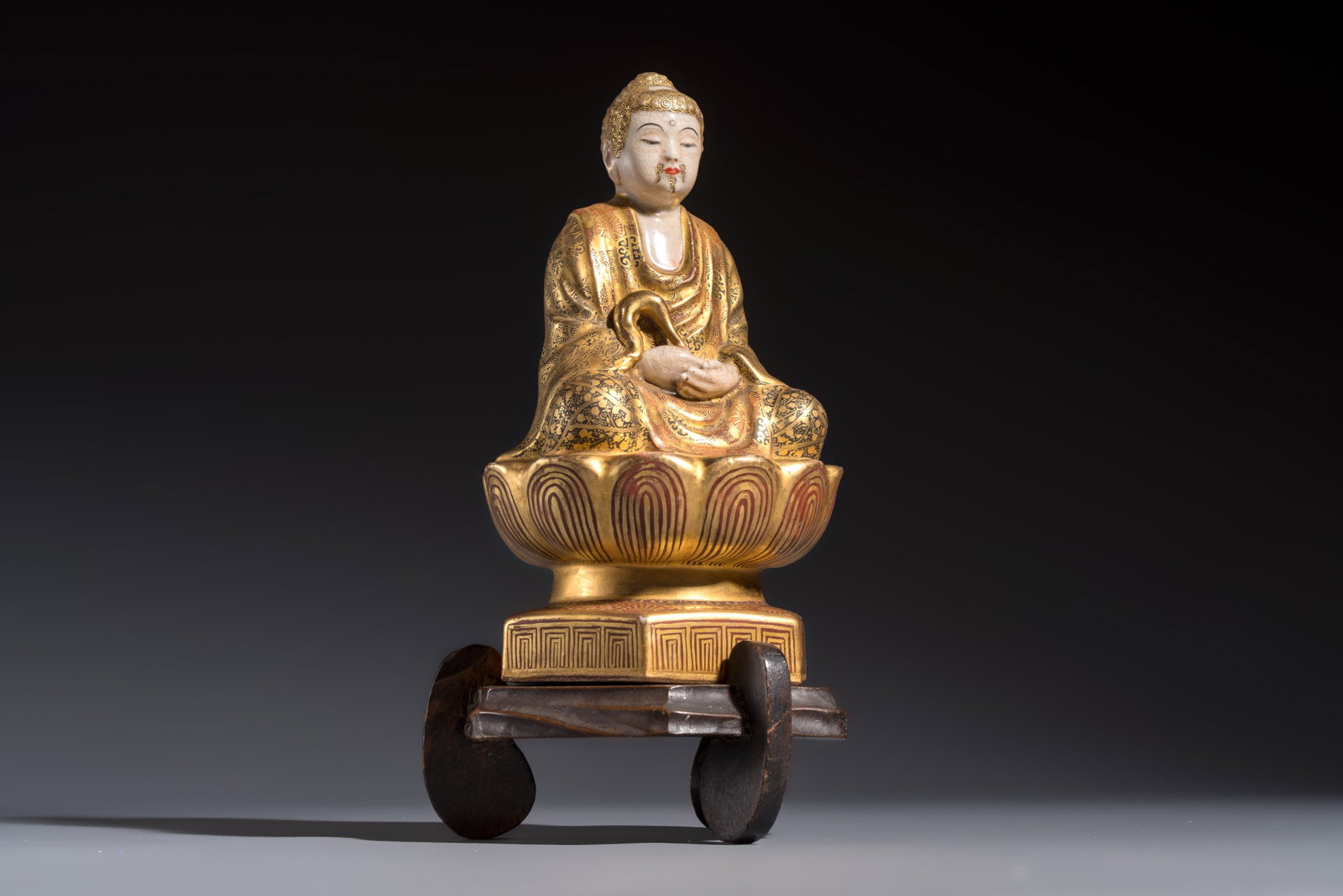 A Japanese Satsuma figure of Buddha seated on a lotus base, Hododa mark, Meiji, 19/20th C. (1 of 9)