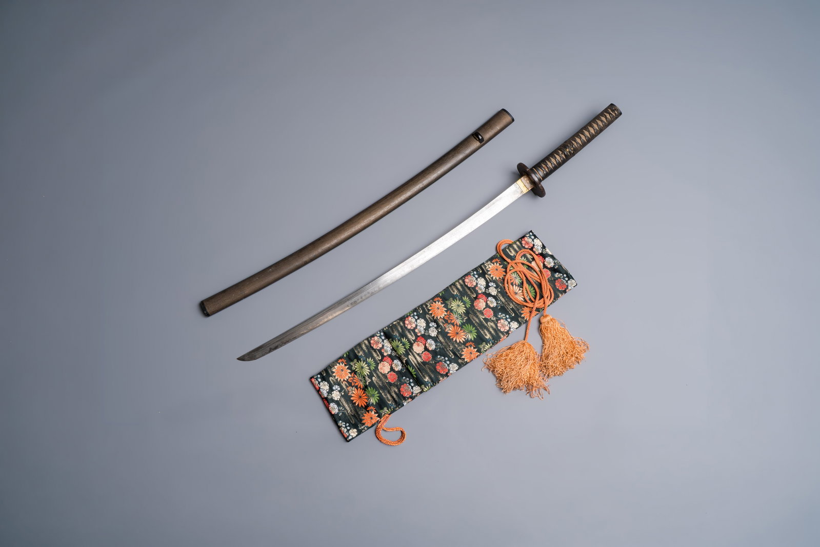 A Japanese katana, signed Hizen no Kuni Dewa no Kami Fujiwara Yukihiro, with koshirae, Edo, dated: A Japanese katana, signed Hizen no Kuni Dewa no Kami Fujiwara Yukihiro, with koshirae, Edo, dated Genroku 15 (1702) L.: 104,5 cm (koshirae) L.: 91,3 cm (nagasa) L.: 2 cm (saki-haba) L.: 3,1 cm (moto-h