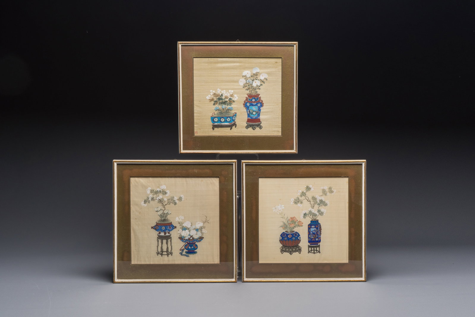 Chinese school: a set of three 'Floral Arrangements' paintings, ink and colour on silk, Republic: Chinese school: a set of three 'Floral Arrangements' paintings, ink and colour on silk, Republic Dim.: 35,5 x 36 cm (thelargestframe) Dim.: 25,2 x25,9cm (the largest work) Dim.: 33,5 x 35,5 cm (the sm
