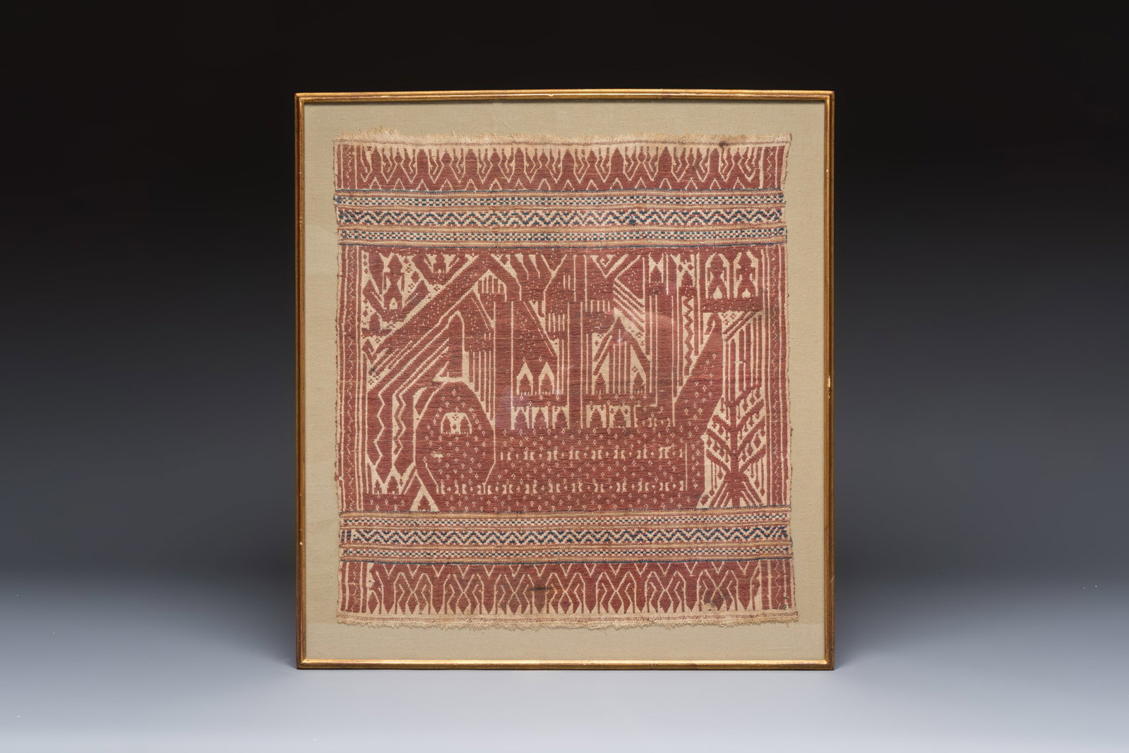 An Indonesian ceremonial 'Tampan' textile, Sumatra, Lampung, 19/20th C.: An Indonesian ceremonial 'Tampan' textile, Sumatra, Lampung, 19/20th C. Dim.: 57,5 x 53,5 cm (the frame) Dim.:50 x 45 cm (the textile)