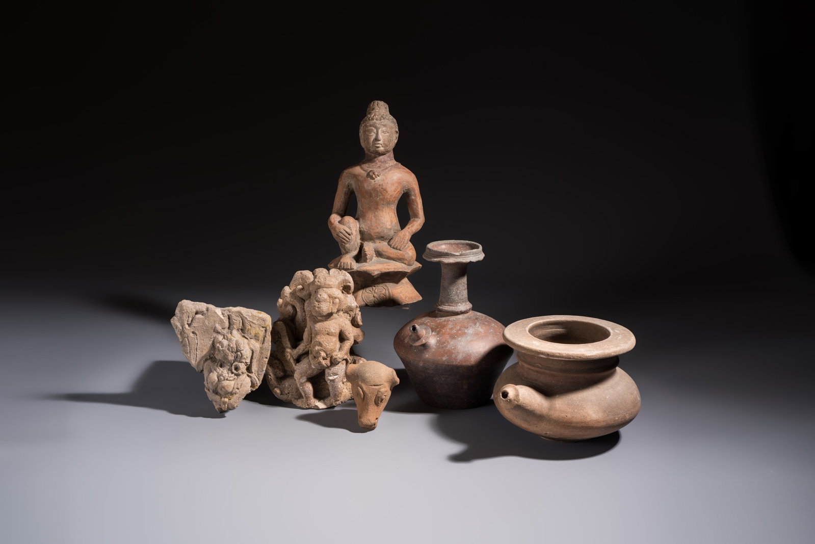 Five various pottery wares and a carved stone fragment, South Asia and Southeast Asia, 18th C. and (1 of 17)
