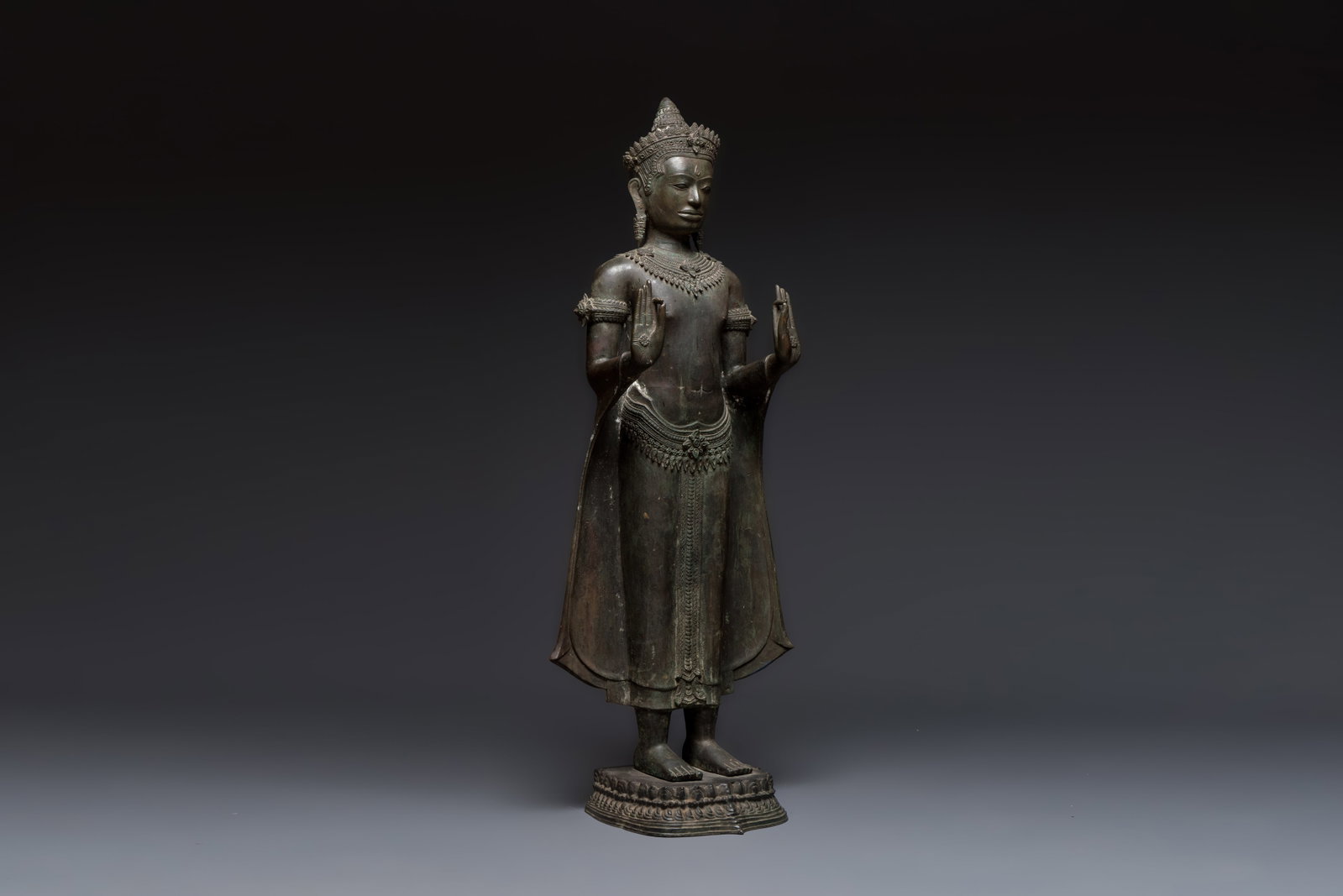A large bronze Lopburi-style standing Buddha Shakyamuni, Thailand or Cambodia, 20th C. (1 of 7)
