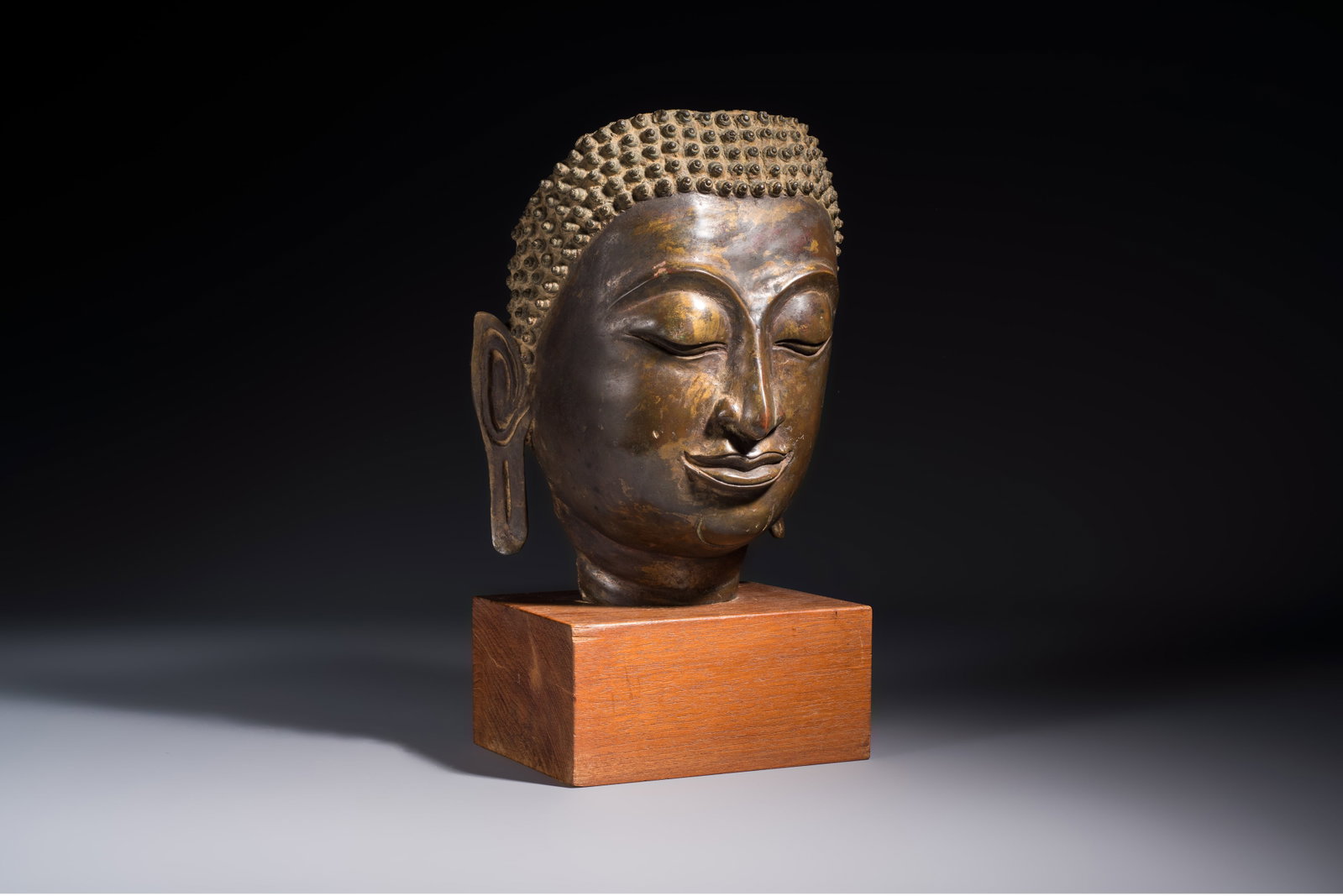 A bronze head of Buddha, Thailand, probably Ayutthaya period, 16/17th C. (1 of 7)