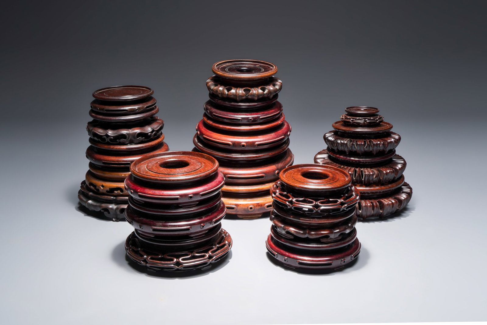 A collection of 20 Chinese wooden stands, 19/20th C. (1 of 4)