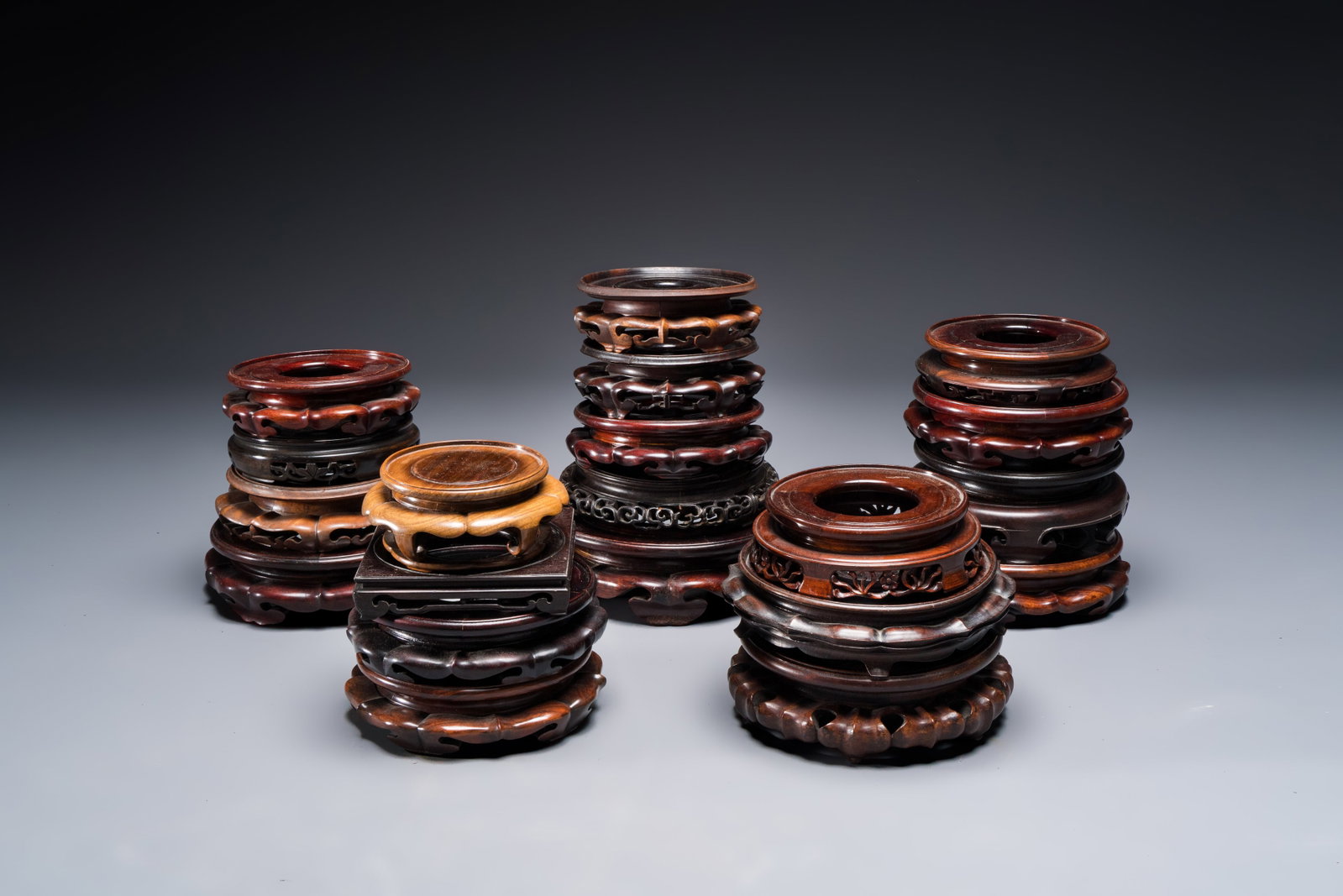 A collection of 20 Chinese wooden stands, 19/20th C. (1 of 4)