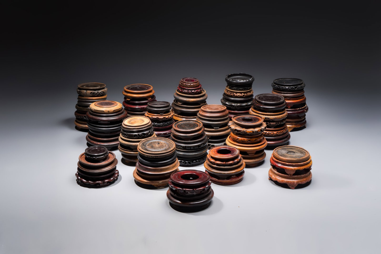 A collection of 75 Chinese wooden stands, 19/20th C. (1 of 4)