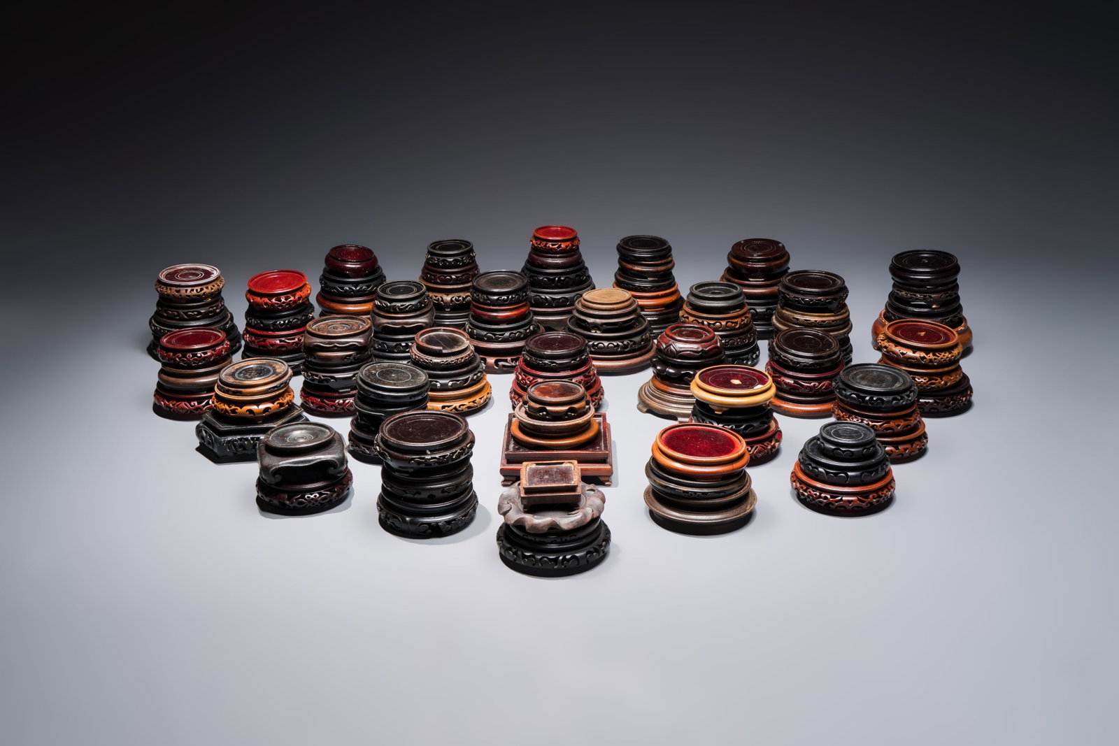 A collection of 111 Chinese wooden stands, 19/20th C. (1 of 4)