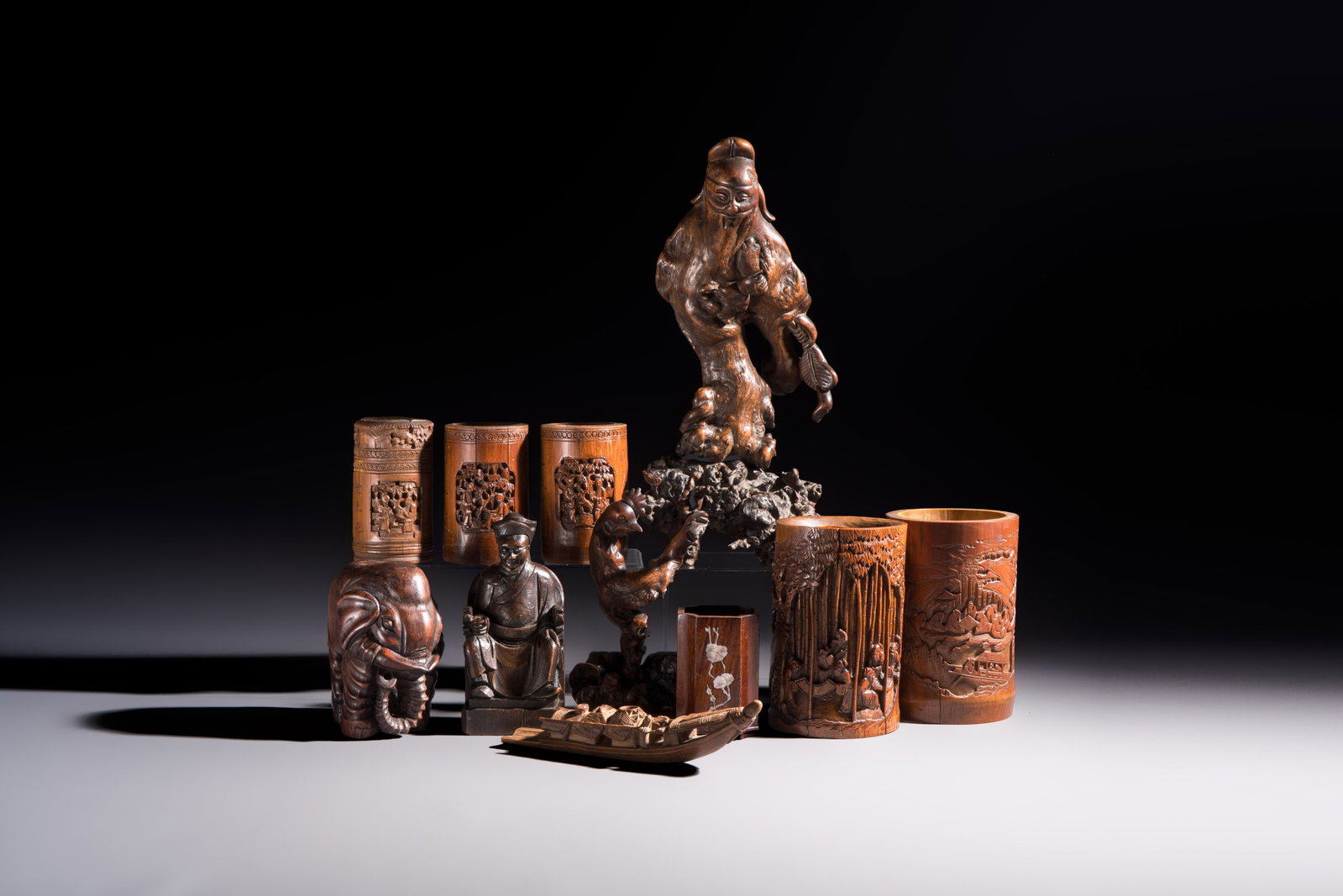 A group of 11 Chinese carved bamboo and wooden works, 19/20th C. (1 of 20)