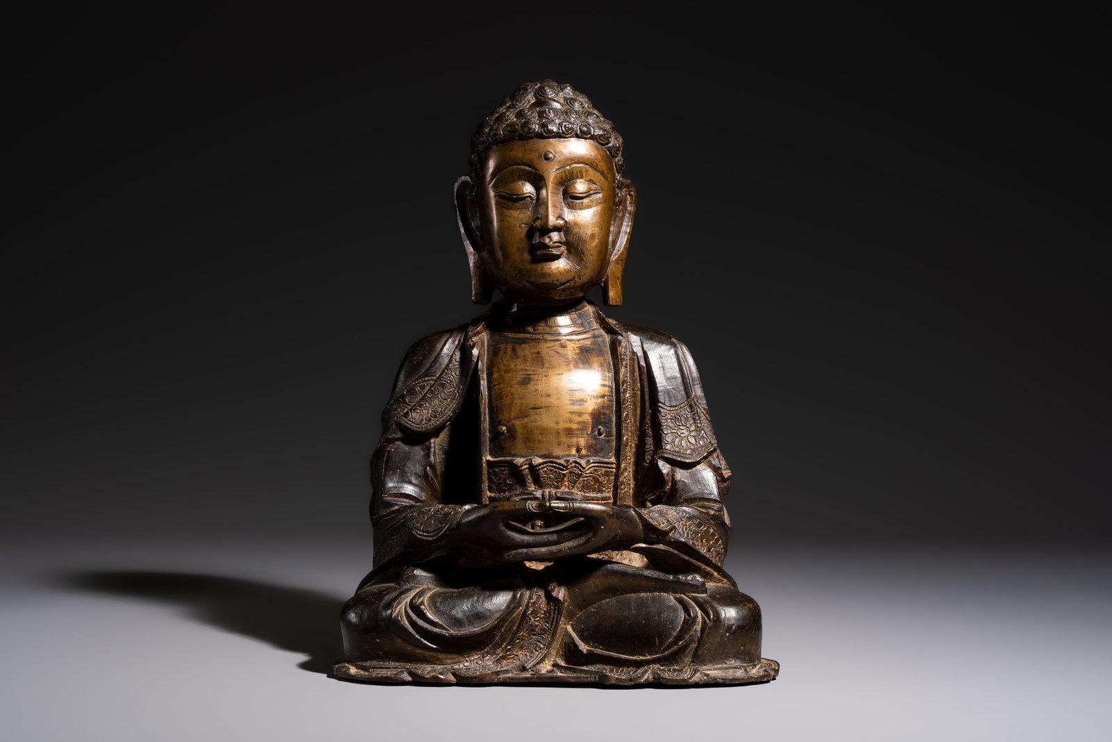 A Chinese bronze seated Buddha, Ming: A Chinese bronze seated Buddha, Ming H.: 34,7 cm Weight: 8,9 kilograms