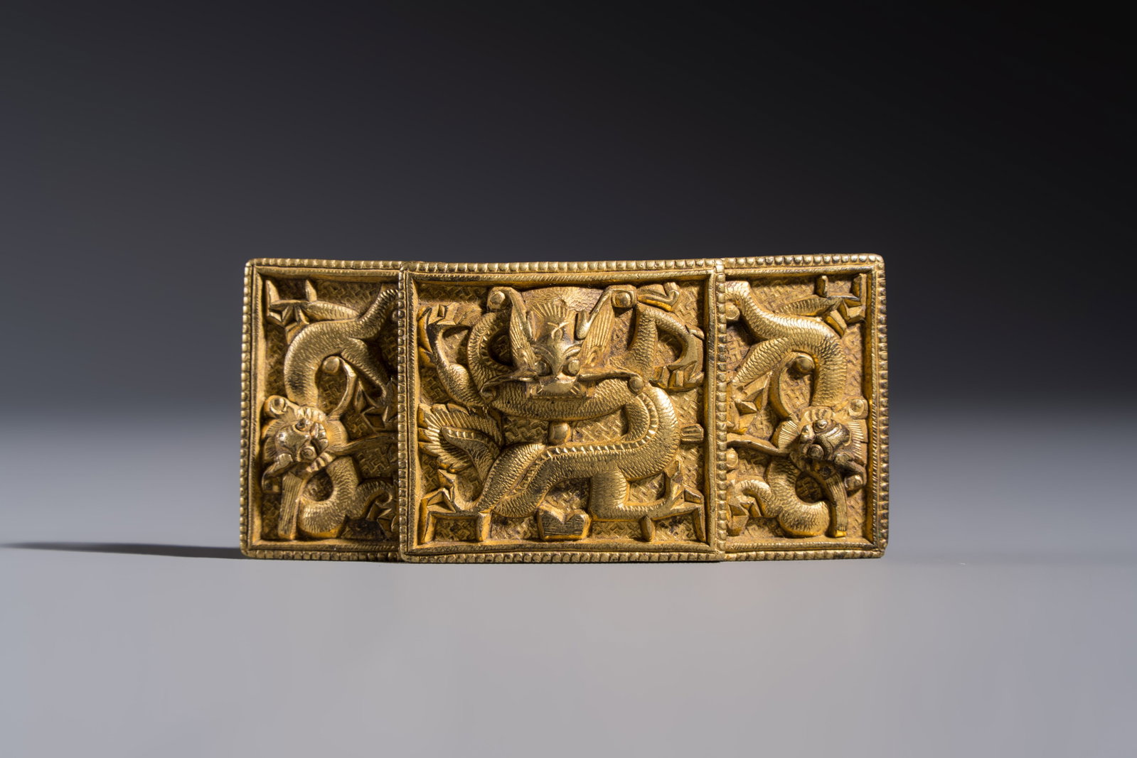 A Chinese gilt-bronze 'Dragon' belt buckle, 19th C. (1 of 5)