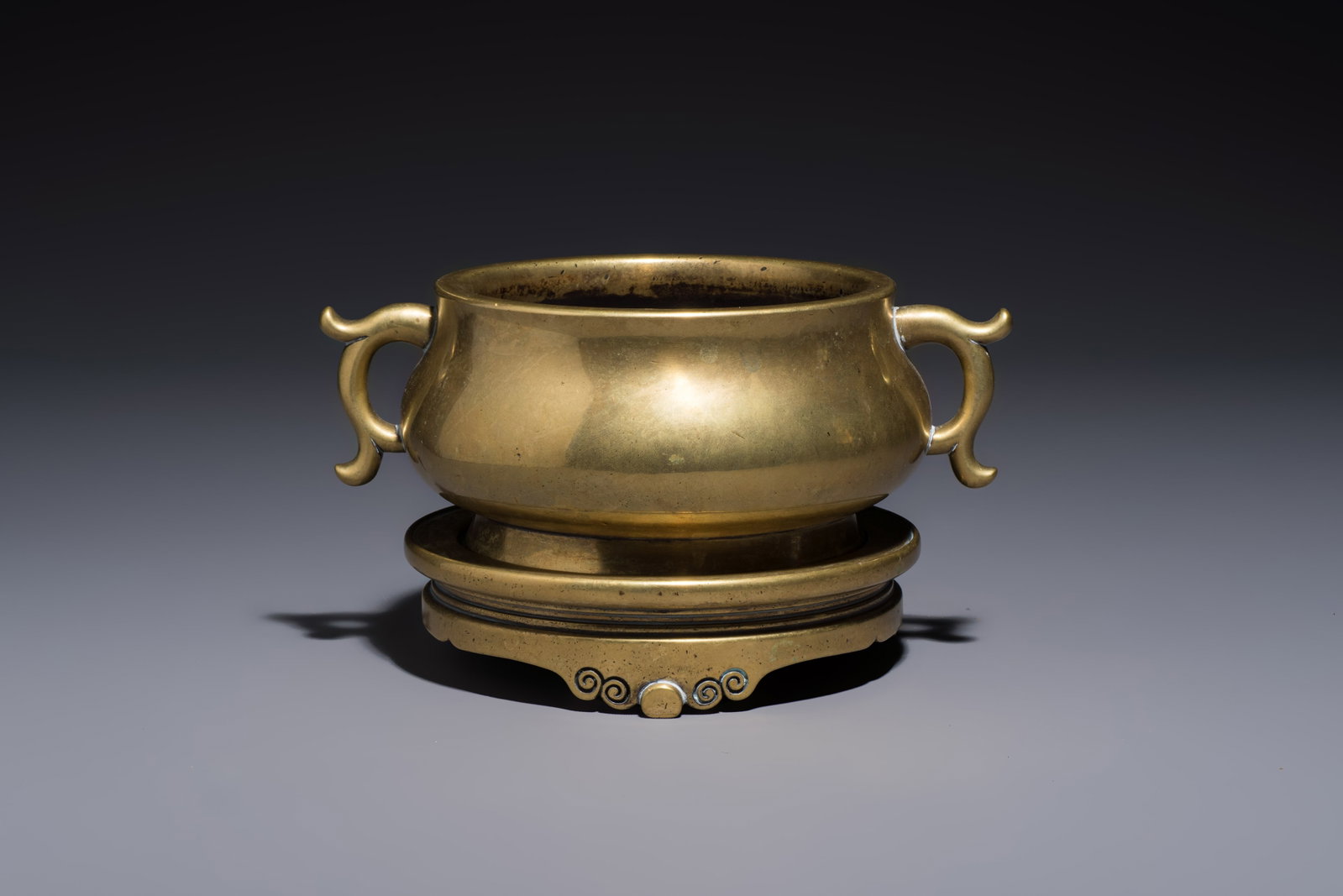 A Chinese bronze handled censer and stand, 17/18th C. (1 of 8)