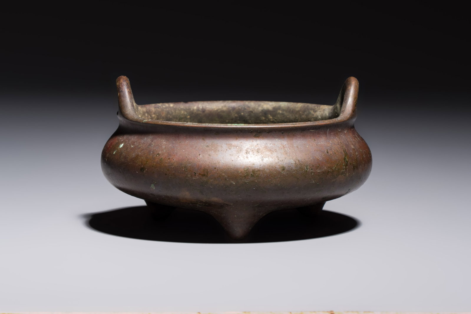 A Chinese bronze handled tripod censer, Yu Tang Jing Wan mark, 17th C. (1 of 7)