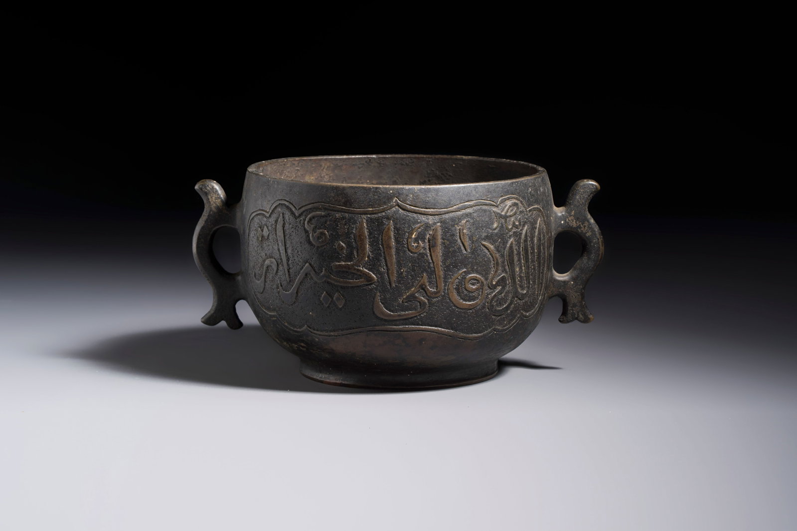 A Chinese bronze censer with Arabic inscription and double fish-form handles, Xuande mark, 17/18th (1 of 7)