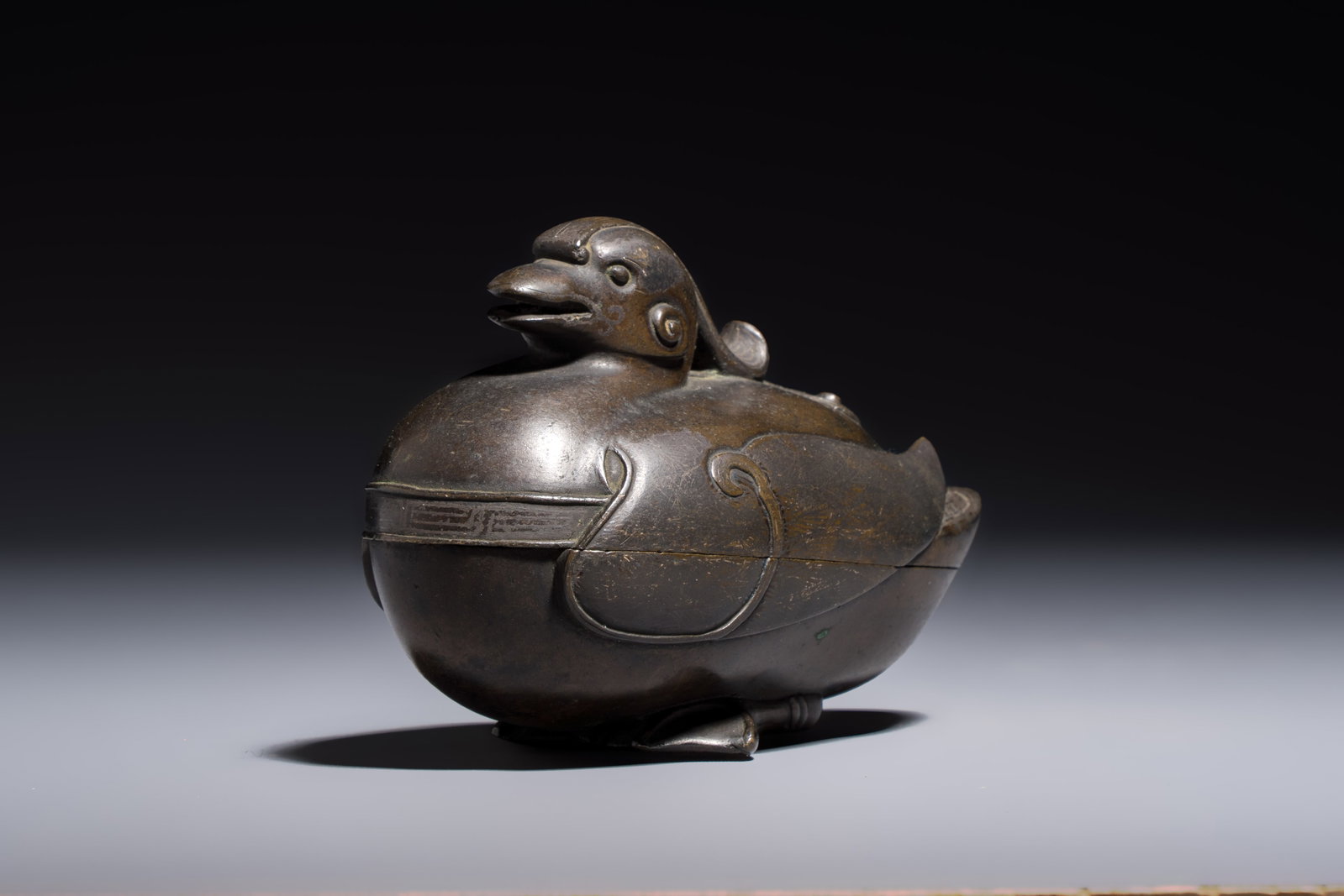 A Chinese silver-inlaid bronze 'Mandarin Duck' censer and cover, Ming (1 of 8)