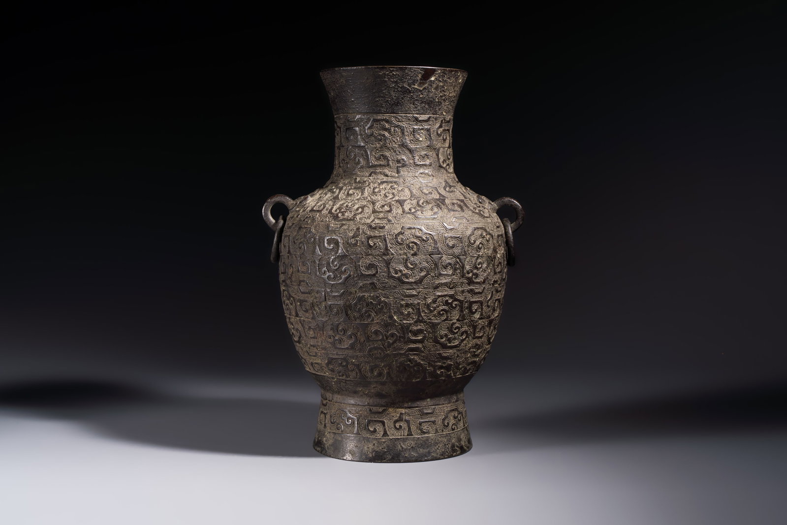 A Chinese archaistic bronze vase with Taotie handles, 'Hu', Ming: A Chinese archaistic bronze vase with Taotie handles, 'Hu', Ming H.: 33,3 cm Weight: 3 kilograms