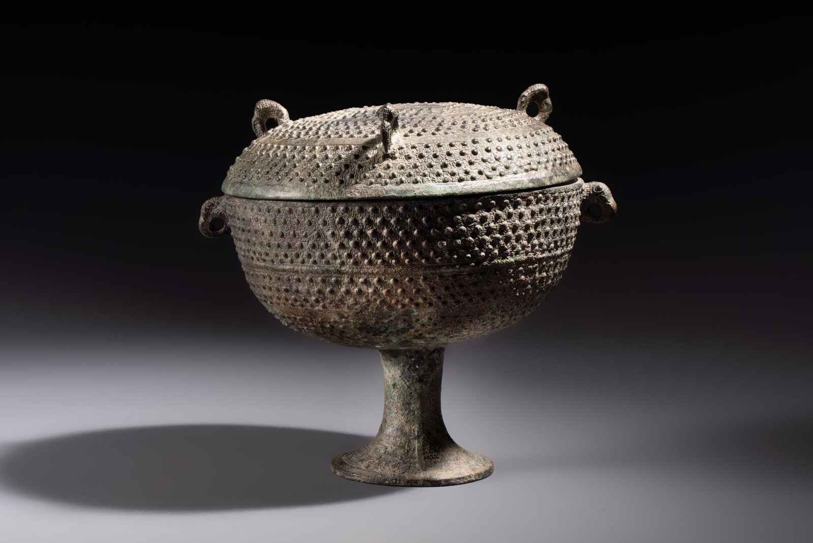 A Chinese archaic bronze food vessel and cover with 'Leiwen' and bosses design, 'Dou', Eastern Zhou (1 of 6)