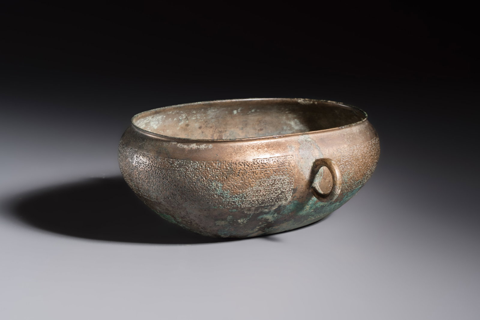 A Chinese archaic bronze two-handled cup with 'Leiwen' design, late Spring and Autumn period (1 of 7)