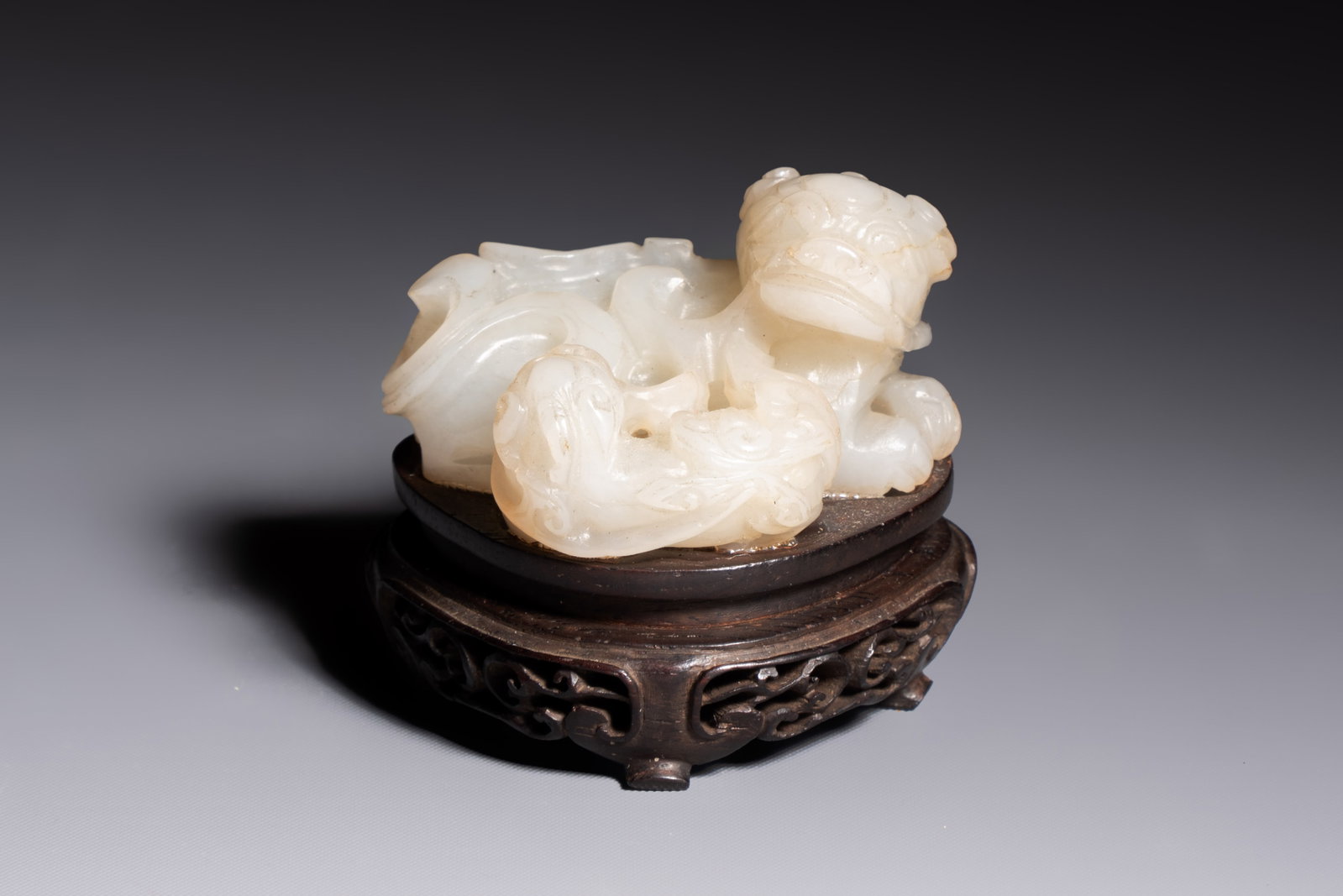 A Chinese carved jade 'Buddhist Lions' group, 19th C. (1 of 7)