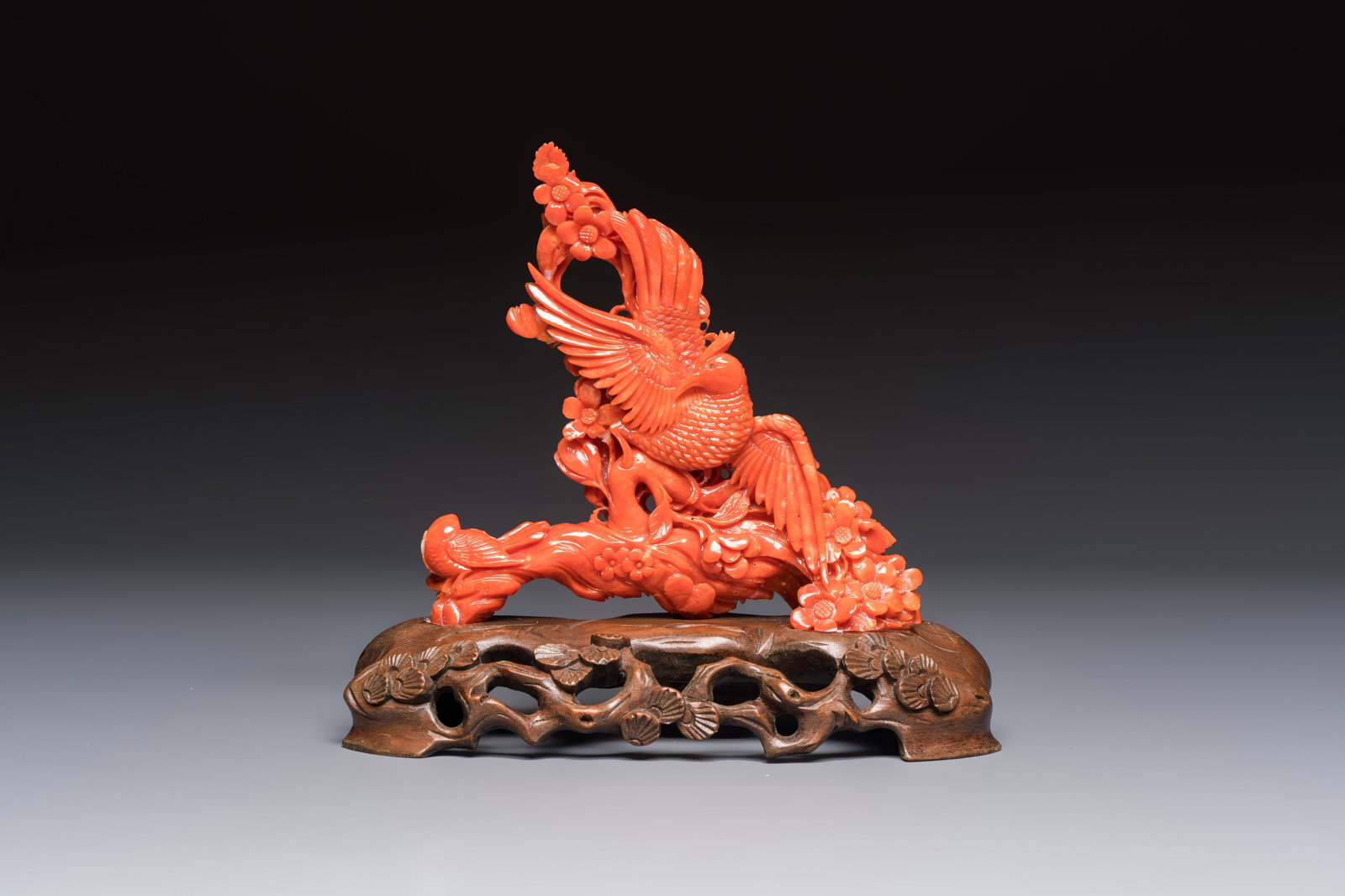 A Chinese carved red coral 'Birds and Flowers' group on a wooden stand, 19/20th C. (1 of 13)