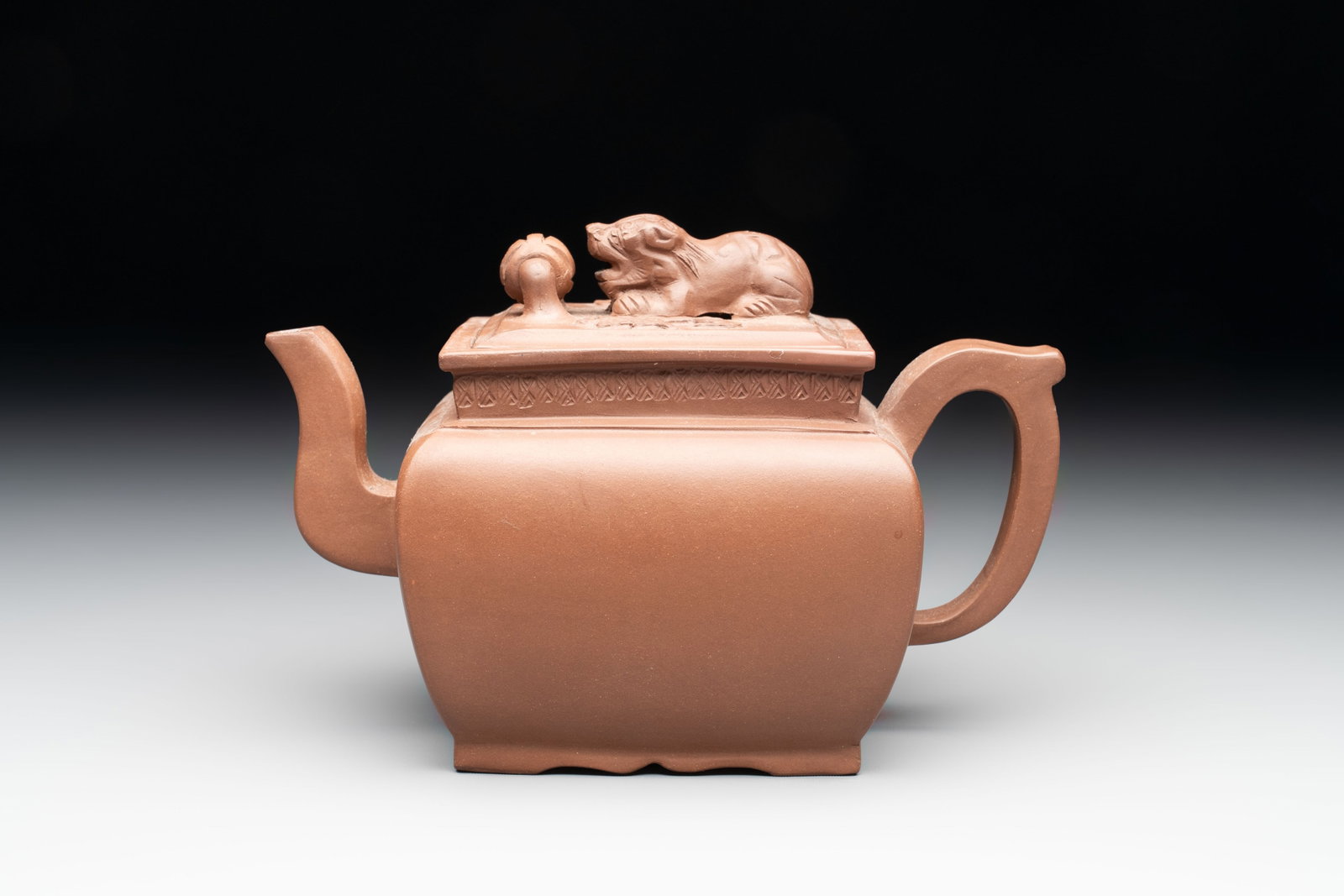 A Chinese Yixing stoneware 'lion and brocade ball' teapot and cover, 19/20th C. (1 of 8)