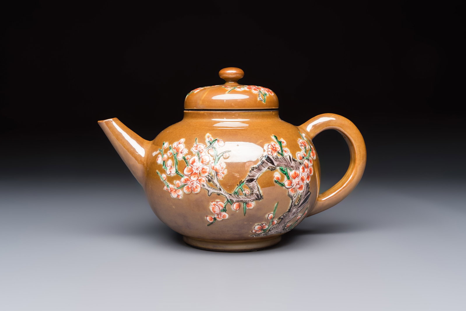 A large Chinese famille verte capucin-ground 'Prunus Blossoms' teapot and cover with relief design, (1 of 7)