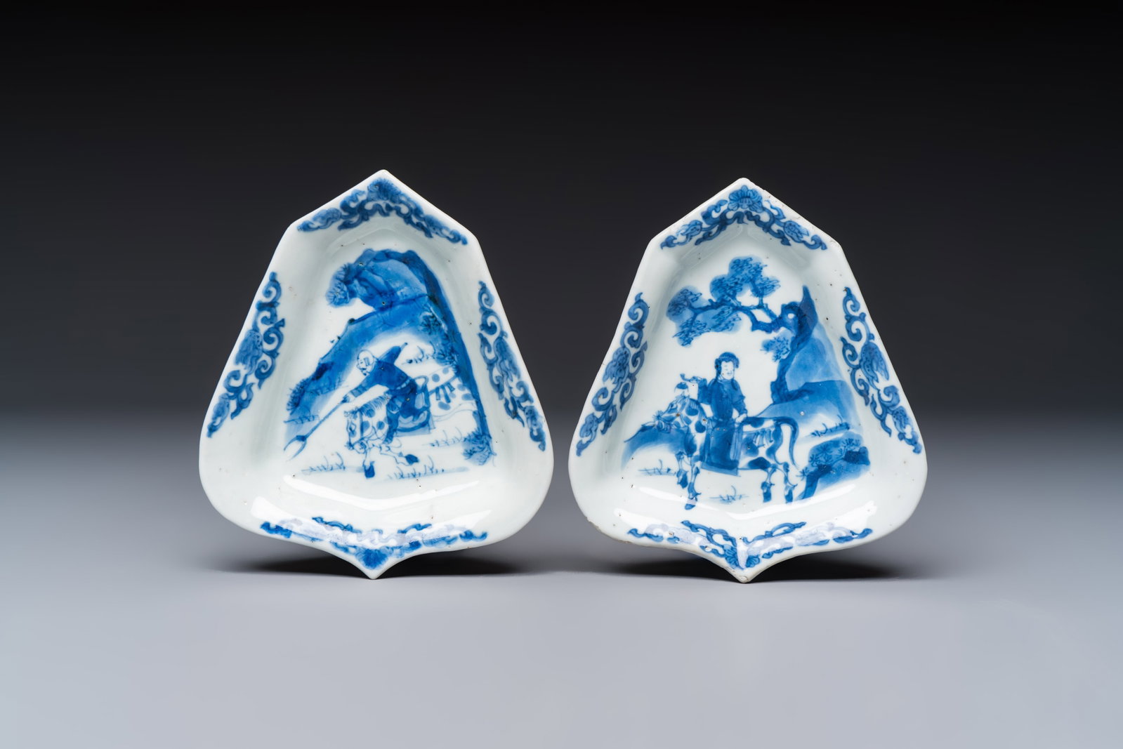 A pair of Chinese blue and white 'Rider on Horseback' sweetmeat dishes, Kangxi (1 of 2)