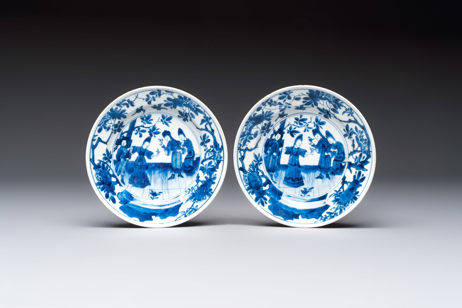 A pair of Chinese blue and white 'Sense of Smell' saucer dishes, artemisia leaf mark, Kangxi: A pair of Chinese blue and white 'Sense of Smell' saucer dishes, artemisia leaf mark, Kangxi Dia.: 15,6 cm