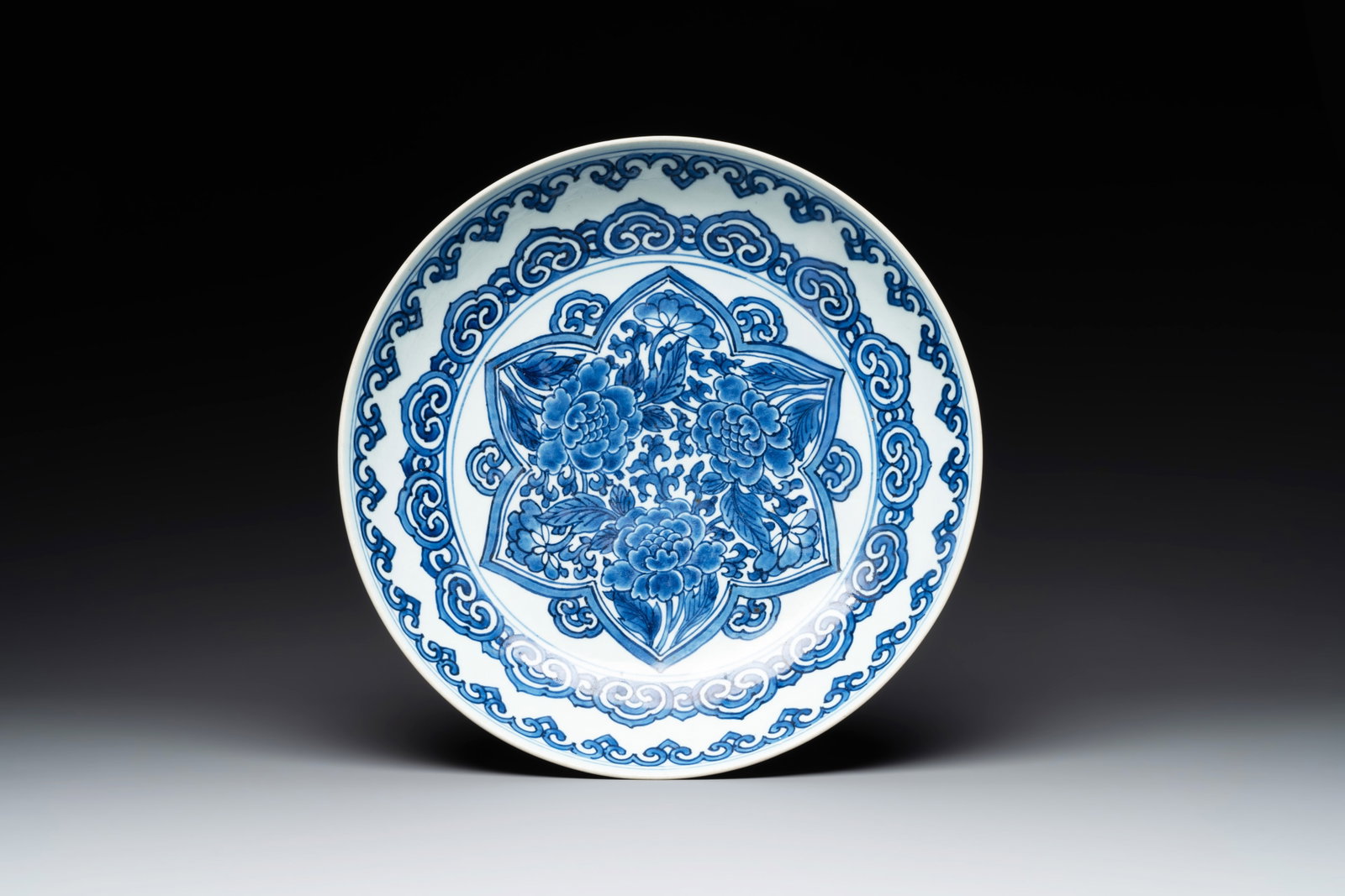 A Chinese blue and white 'peony' dish, Kangxi (1 of 2)