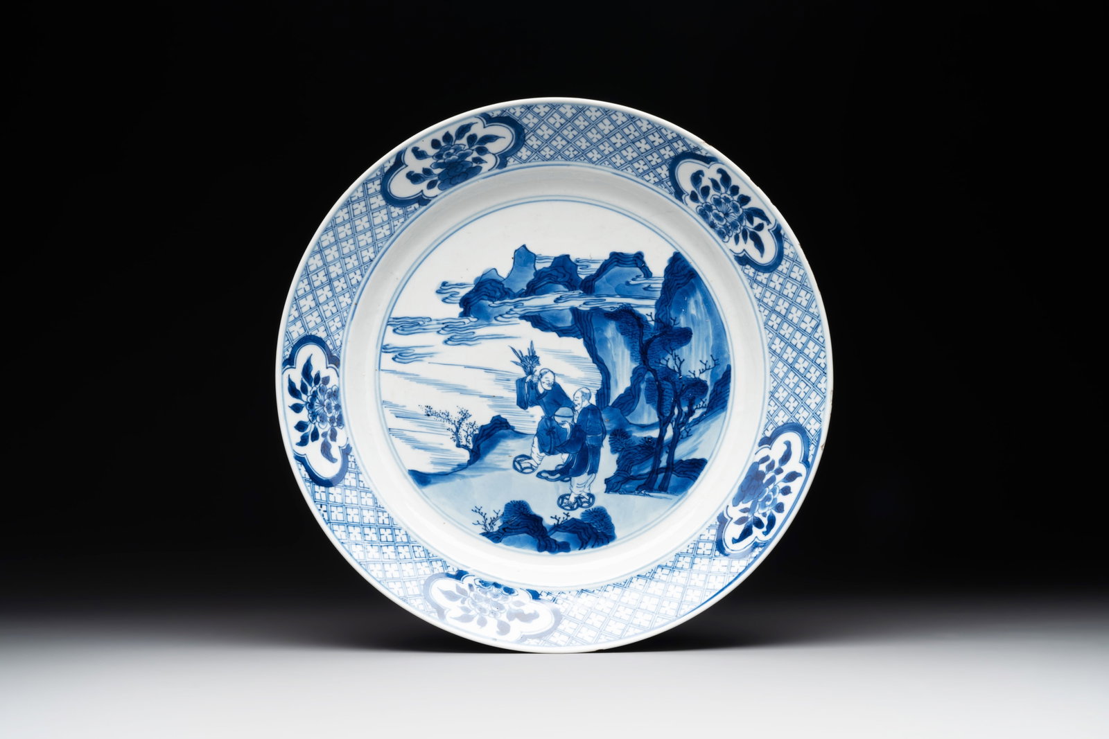 A Chinese blue and white 'Hehe Erxian' dish, Jiajing mark, Kangxi (1 of 2)