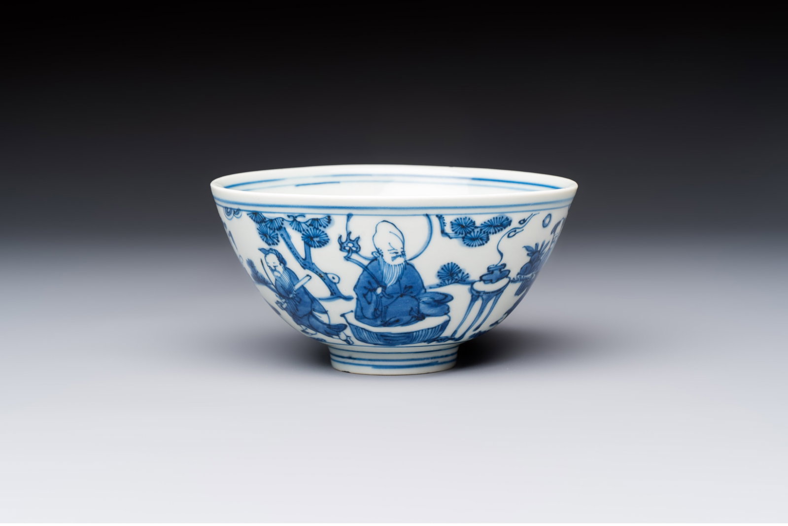A Chinese blue and white 'Ba Xian Zhu Shou' bowl, Wanli mark and of the period (1 of 7)