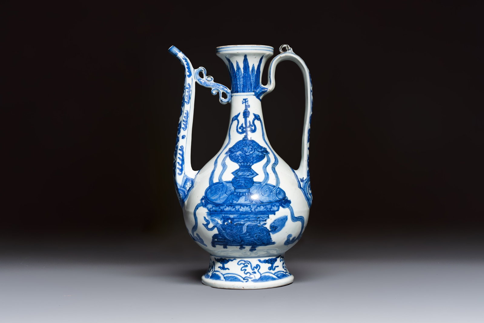 A Chinese blue and white 'Magic Fountain' ewer, heaven mark, Jiajing: A Chinese blue and white 'Magic Fountain' ewer, heaven mark, Jiajing L.: 18,2 cm - H.: 31 cm This rare blue and white porcelain ewer with 'heaven' mark belongs to the celebrated group of so-called 'Ma