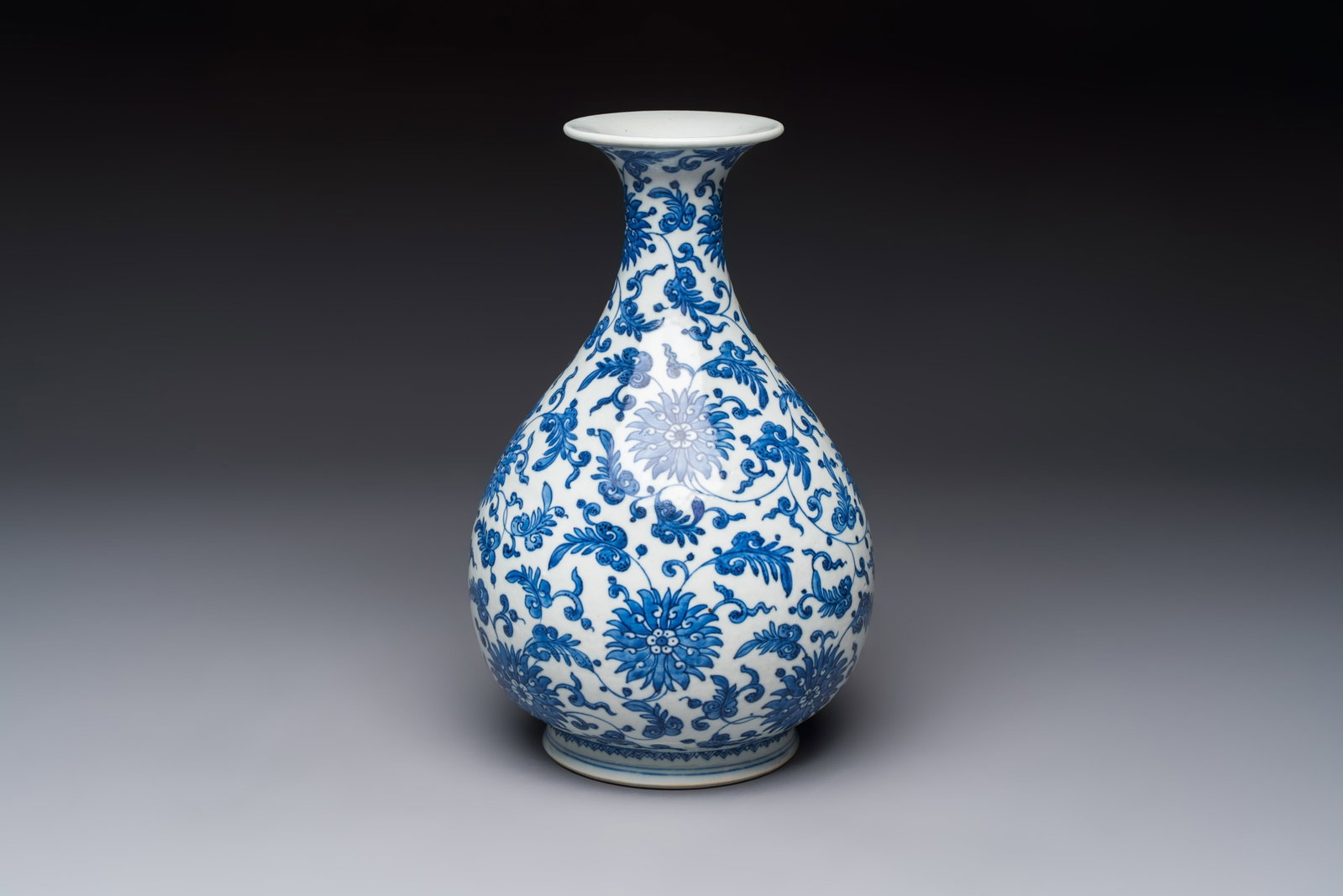 A Chinese blue and white 'Yuhuchunping' vase with lotus scroll design, Qianlong mark and of the (1 of 7)