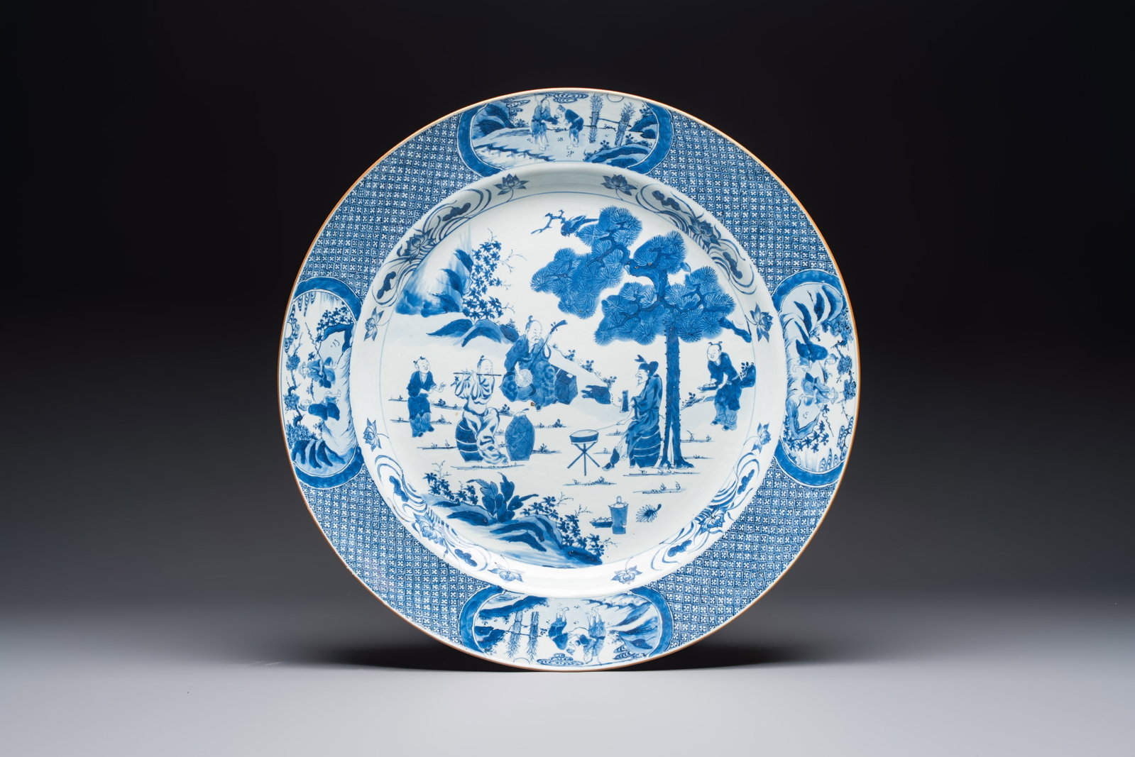 A massive Chinese blue and white 'Music-Making Scholars' dish, Yongzheng (1 of 2)