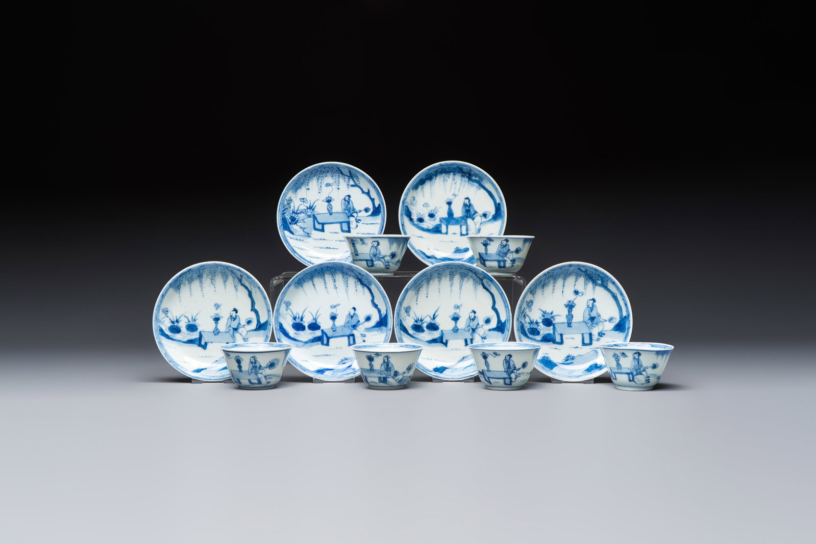 Six Chinese blue and white 'Scholar in a Garden' cups and saucers, Yongzheng: Six Chinese blue and white 'Scholar in a Garden' cups and saucers, Yongzheng Dia.: 11,7 cm (the saucers) Dia.: 7,2 cm - H.: 3,9 cm (the cups)