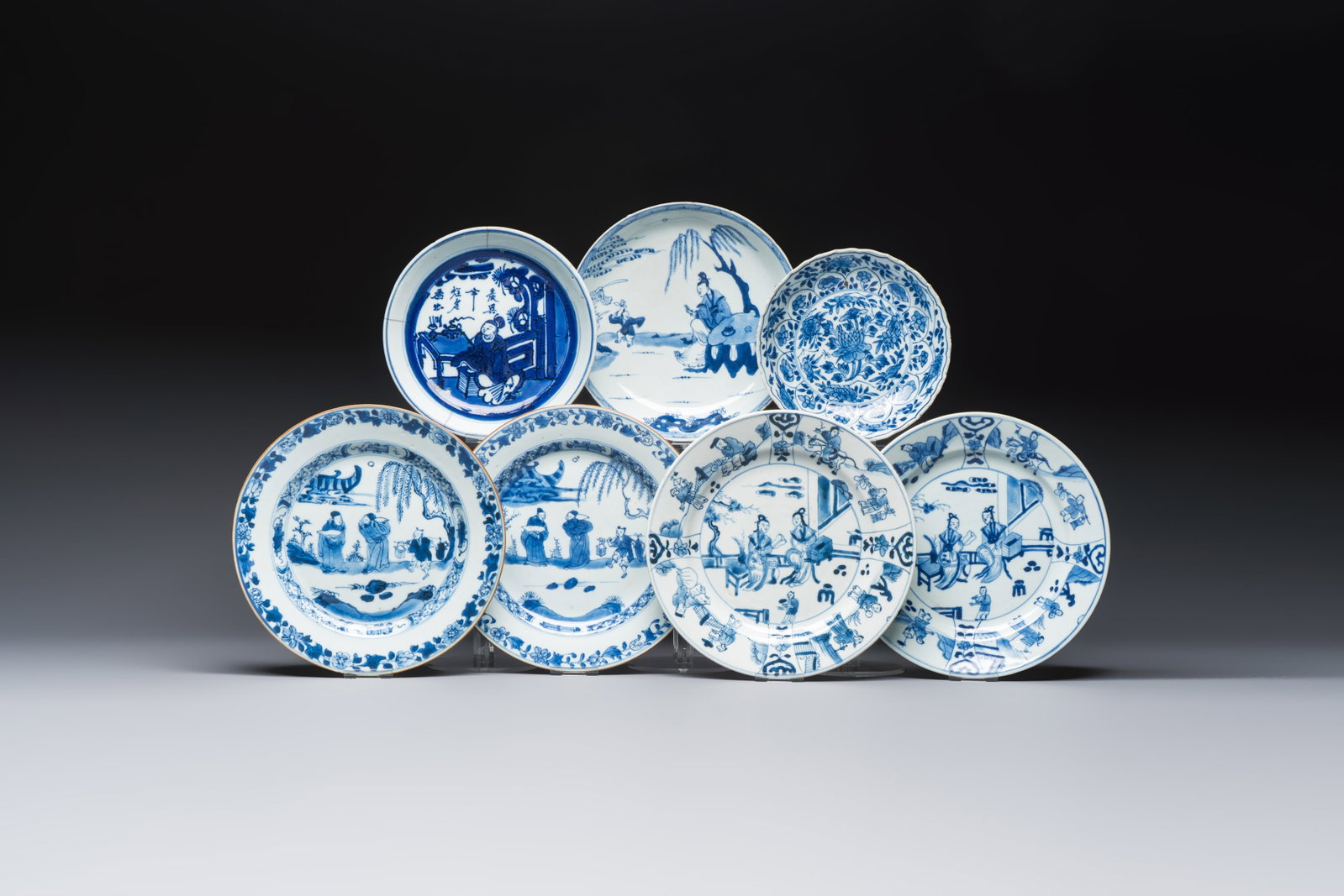 Seven Chinese blue and white plates with figural and floral design, 18/19th C. (1 of 9)