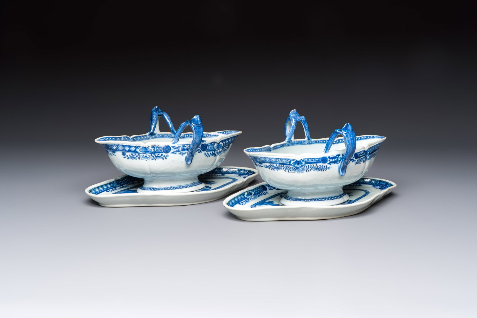 A pair of Chinese blue and white handled sauce boats and stands with pagodas along a river, Qianlong (1 of 10)