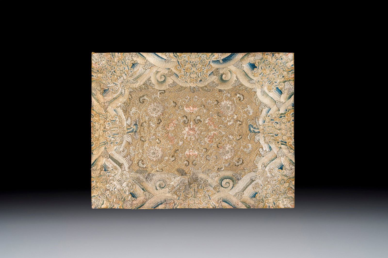 A Chinese cream-ground embroidered silk panel with bats, floral scrolls, waves and rockwork, 19th C. (1 of 2)