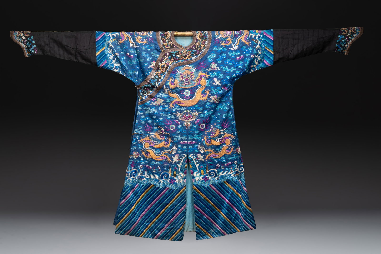 A Chinese blue-ground embroidered silk 'Dragon' robe, 'Ji Fu', 19th C. (1 of 11)