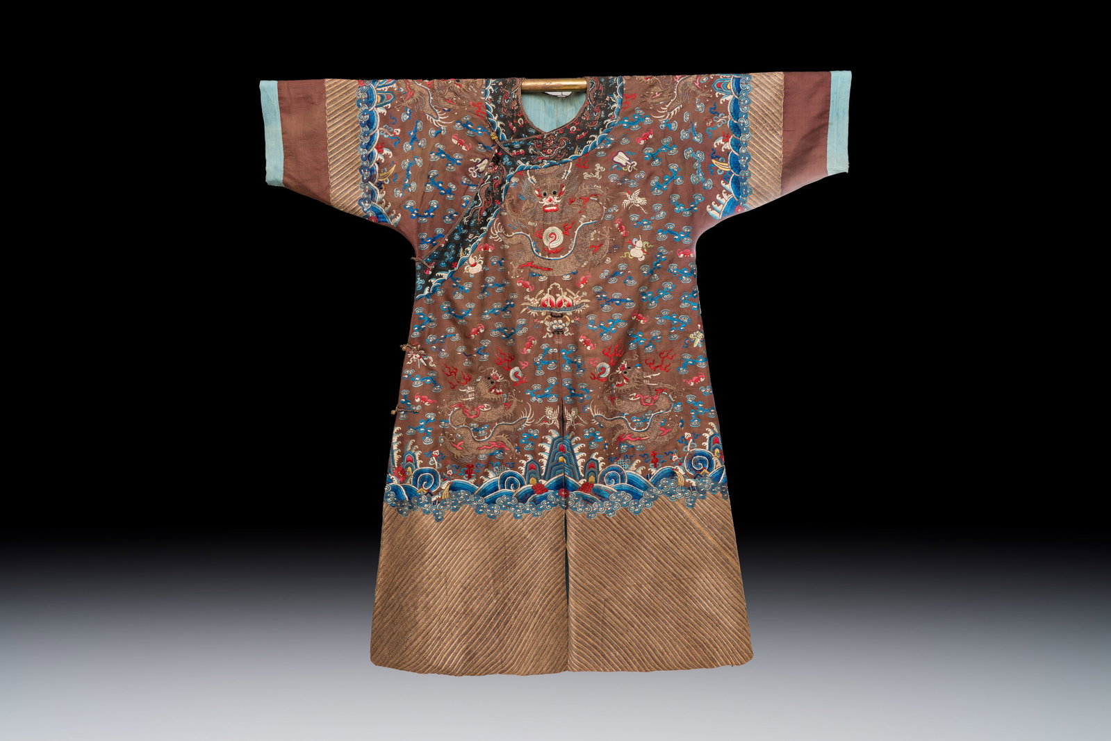 A Chinese brown-ground embroidered silk 'Dragon' robe, 'Ji Fu', 19th C. (1 of 2)