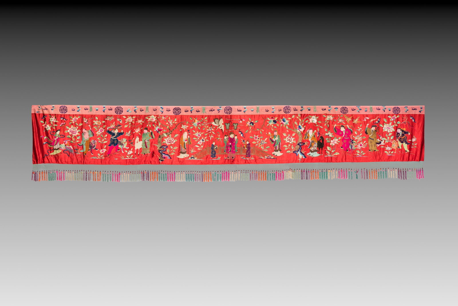 An extremely large Chinese red-ground embroidered silk 'Sanxing and Eight Immortals' panel, 19th C. (1 of 2)