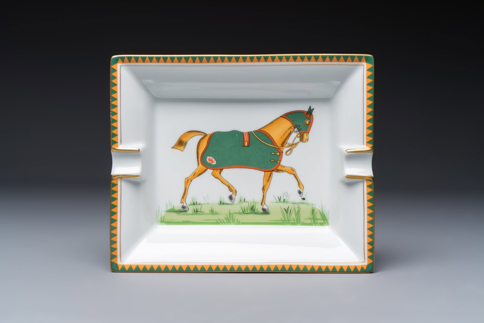 A gilt and polychrome-decorated porcelain 'Horse' ashtray, Hermès, 20th C. (1 of 4)