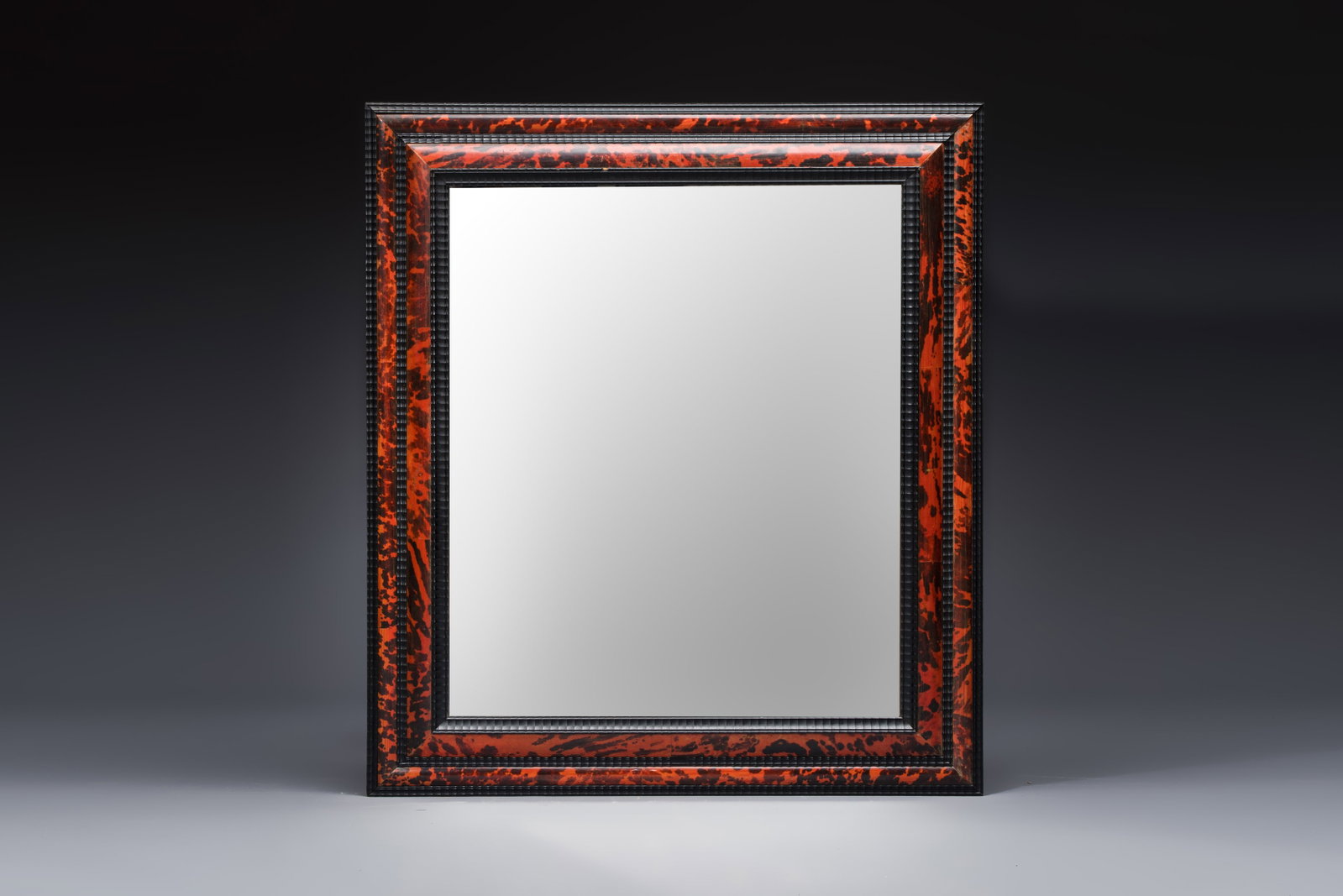 A large rectangular tortoiseshell-veneered and ebonised wood frame with later mirror, probably (1 of 2)