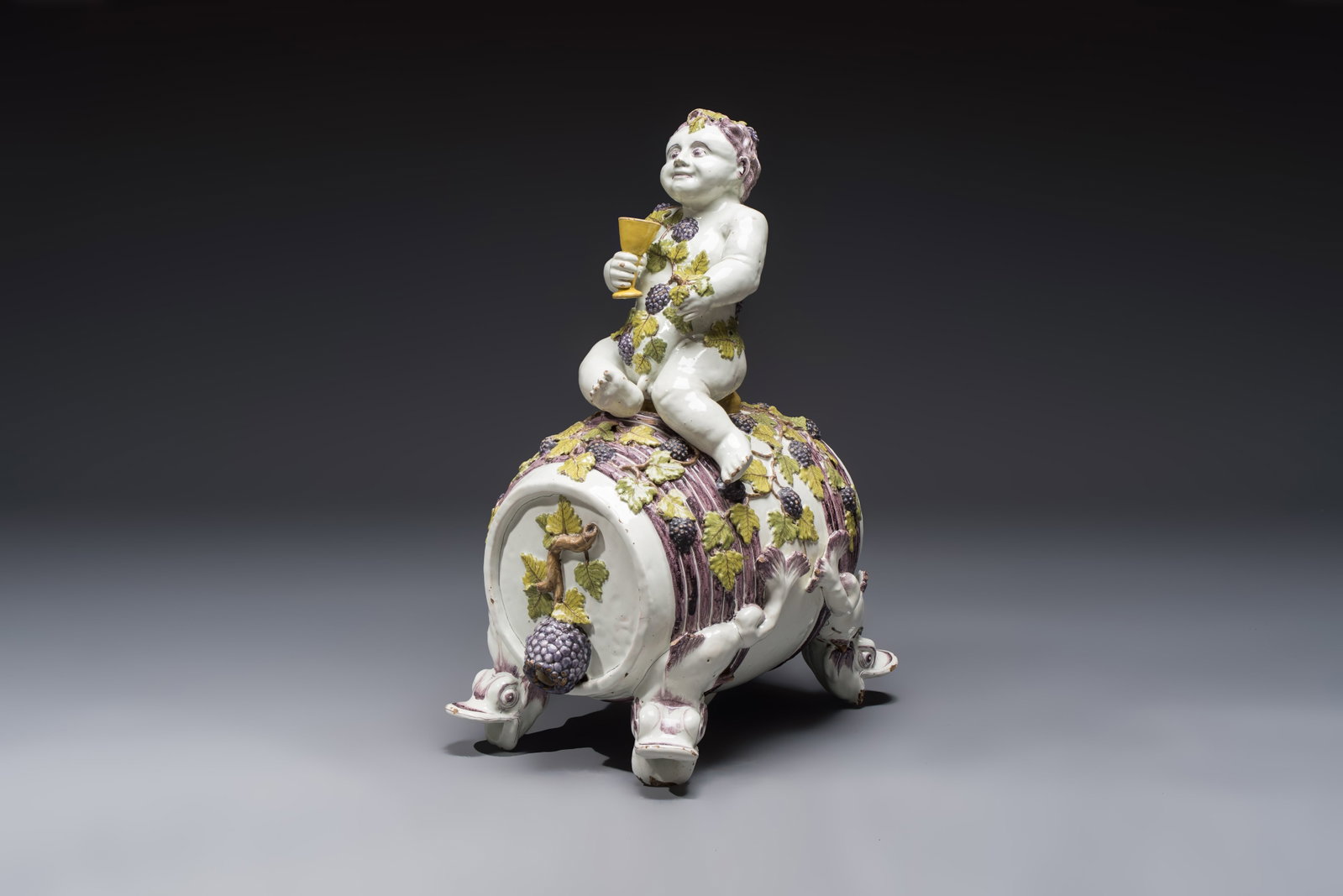 A massive polychrome Brussels faience 'Bacchus on a Barrel' fountain, 18th C. (1 of 8)
