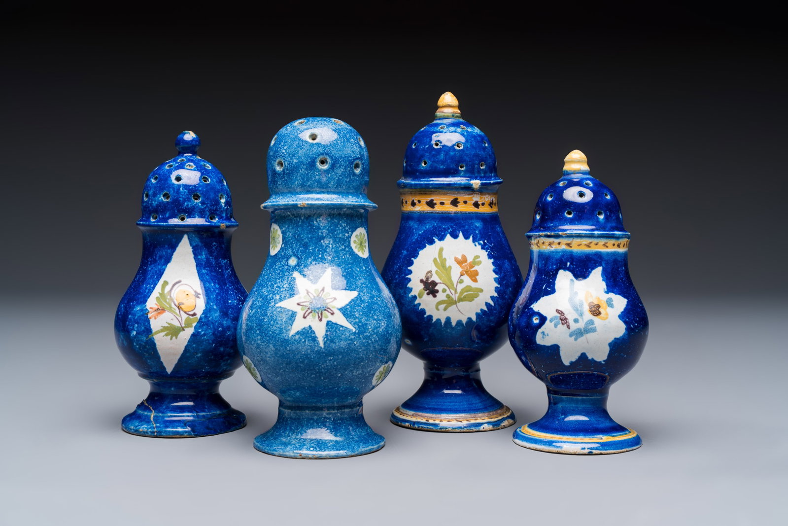 Four polychrome Brussels faience casters, 18/19th C. (1 of 12)